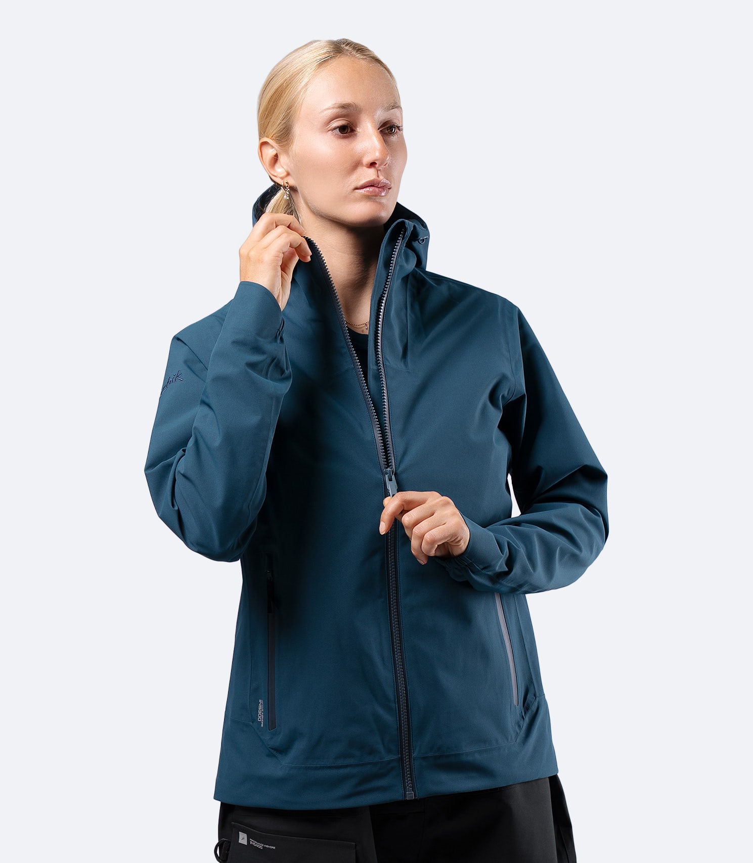 Front view of Zhik INS300 Women's Inshore Active Jacket in Deep Teal on model, hood down and regular cut for layering
