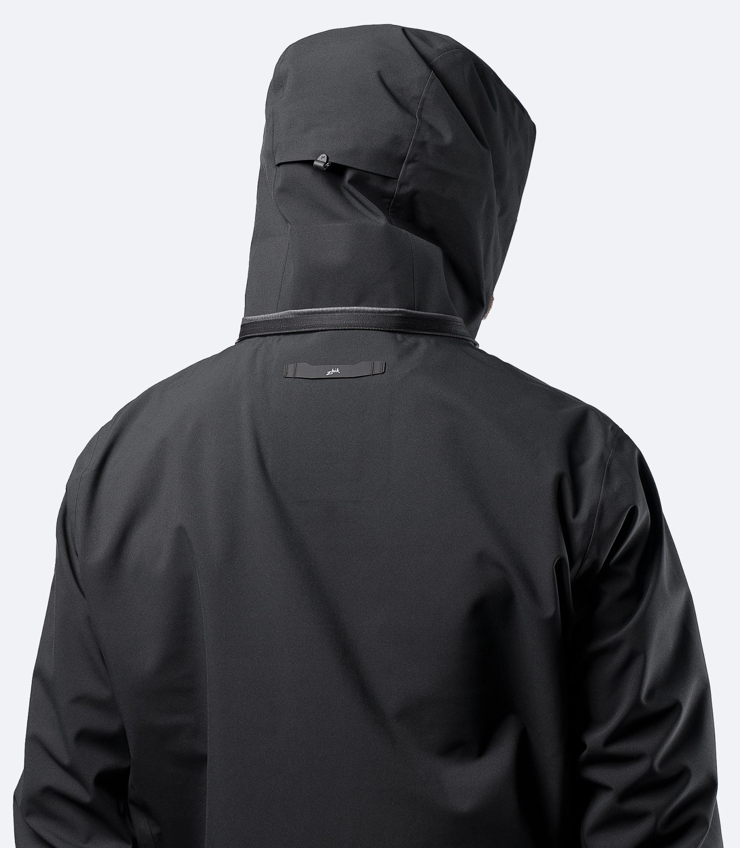 Rear close-up of hood up on Zhik Men's Black INS400 inshore jacket, showing articulated panel shaping