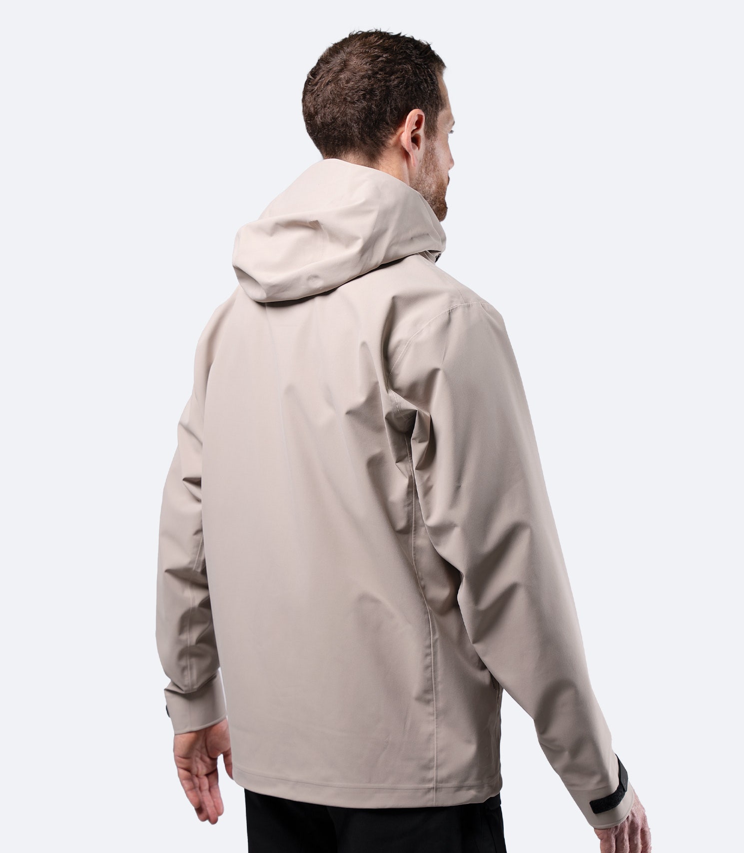 Rear view of Zhik Men's Stone INS400 inshore jacket with hood down, optimised streamlined sports cut