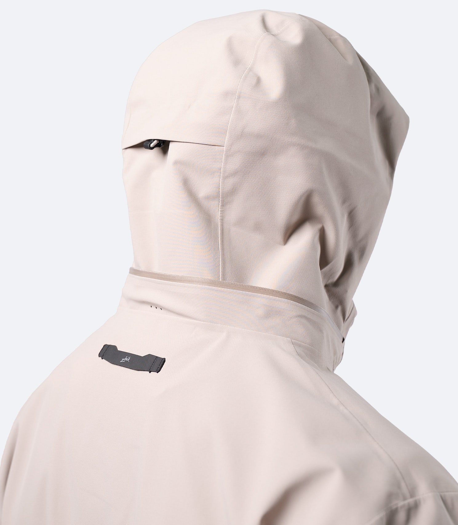 Rear close-up of hood up on Zhik Men's Stone INS400 inshore jacket with Hyperlon hang loop visible