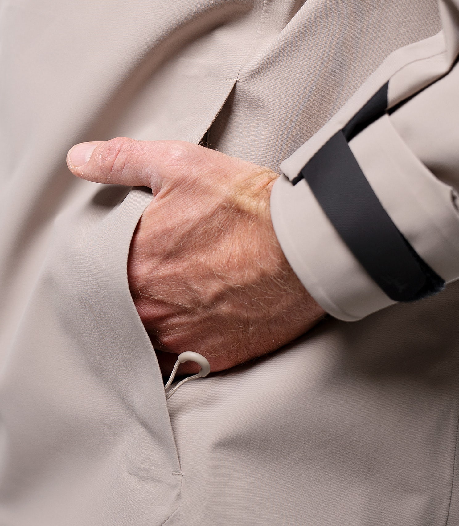Close-up of front pocket on Zhik Men's Stone INS400 inshore jacket with water-resistant zip and drainage