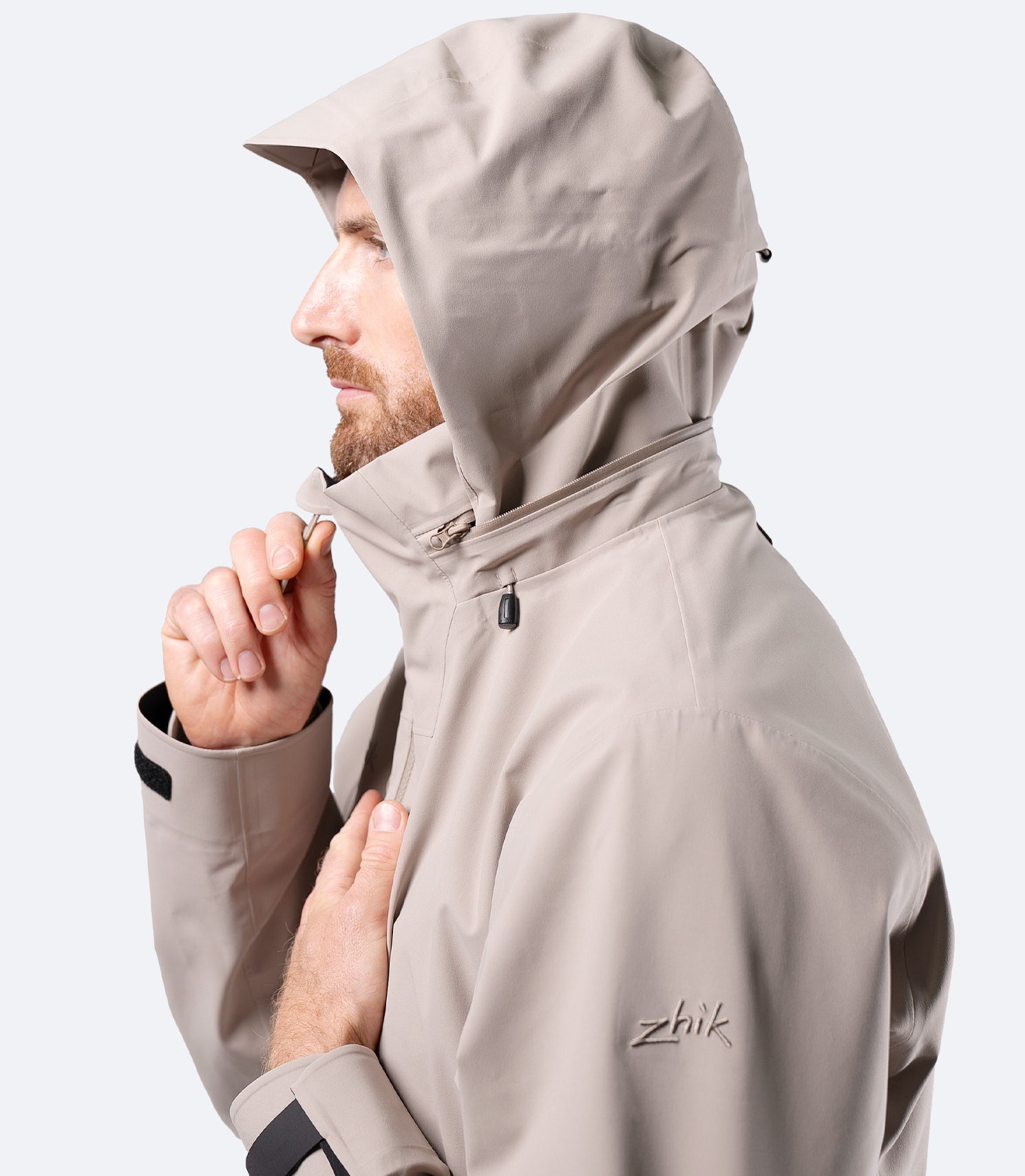 Side close-up of hood up on Zhik Men's Stone INS400 inshore jacket, highlighting face protection and fit