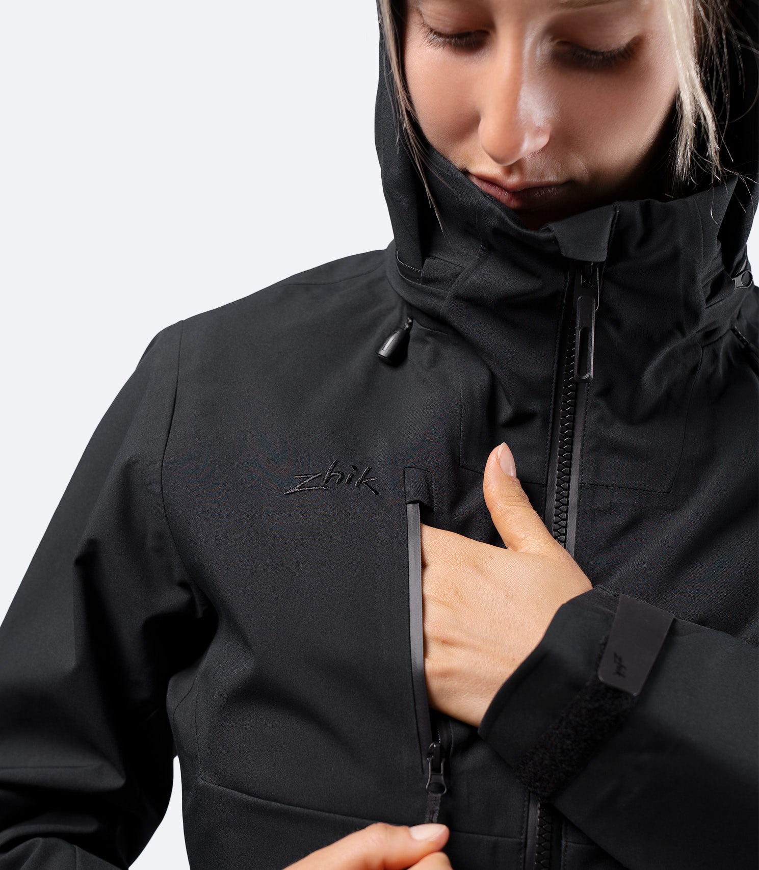 Chest pocket detail on Zhik Women's INS400 jacket in Black, with water resistant zipper and secure storage
