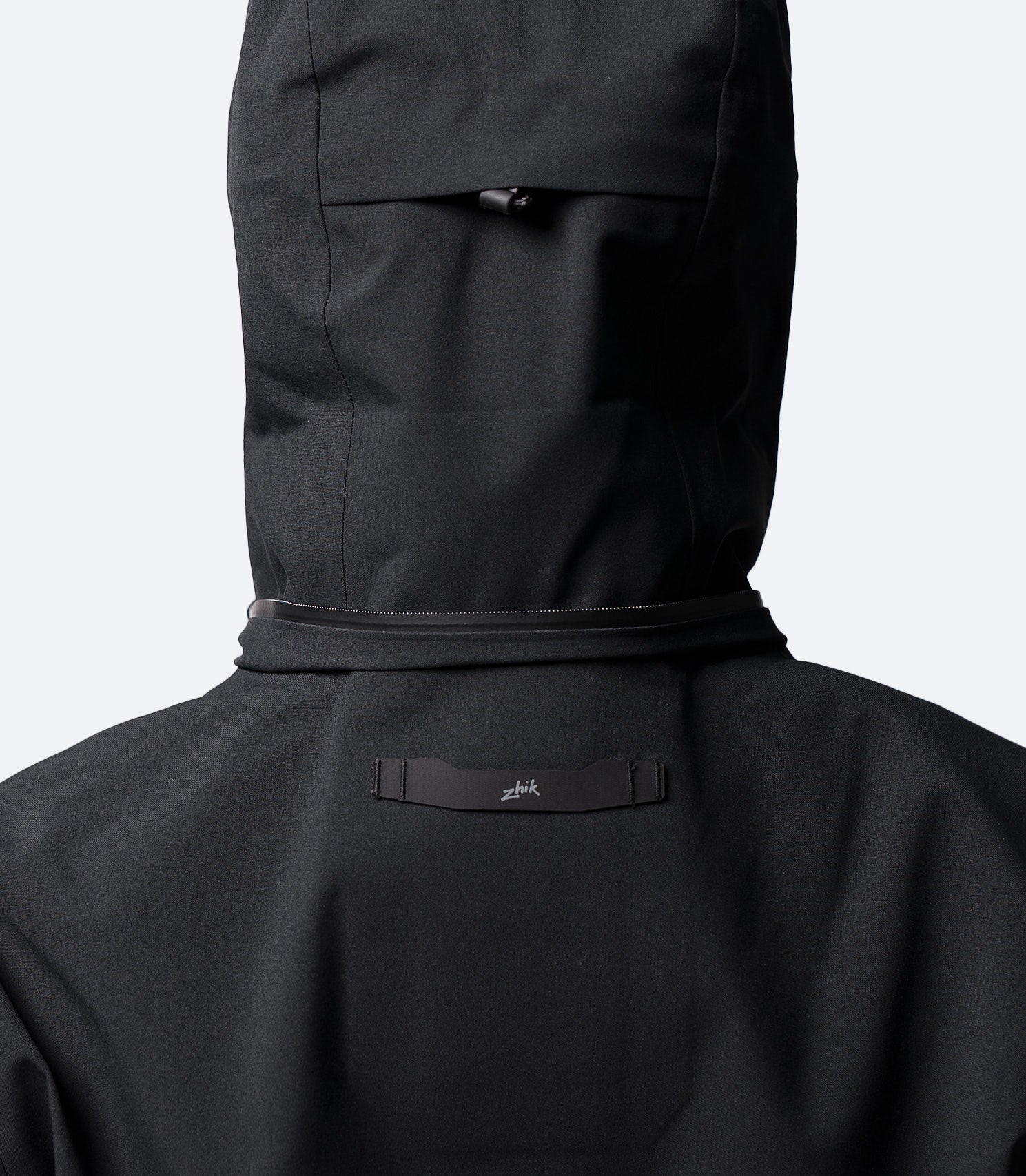 Rear hood detail on Zhik Women's INS400 jacket in Black, showing 3 point adjustment for a secure fit
