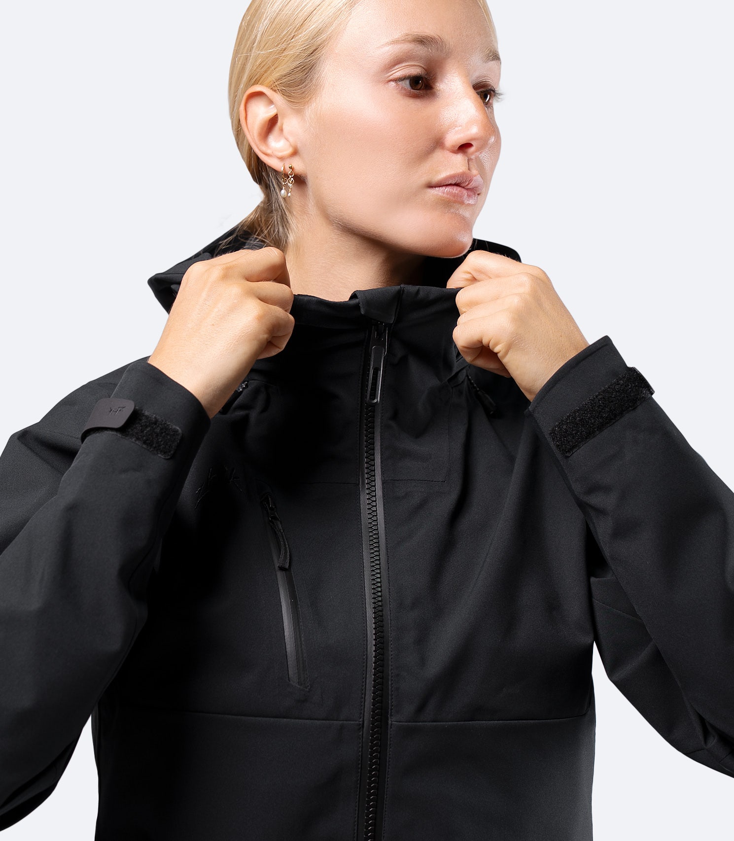 Upper torso view of Zhik Women's INS400 jacket in Black, hood down, showing thermal lined collar