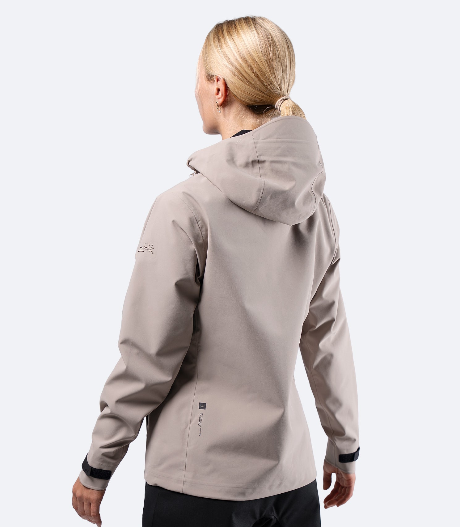 ear view of Zhik Women's INS400 Inshore Jacket in stone with hood down, showing shaped fit and articulated sleeves