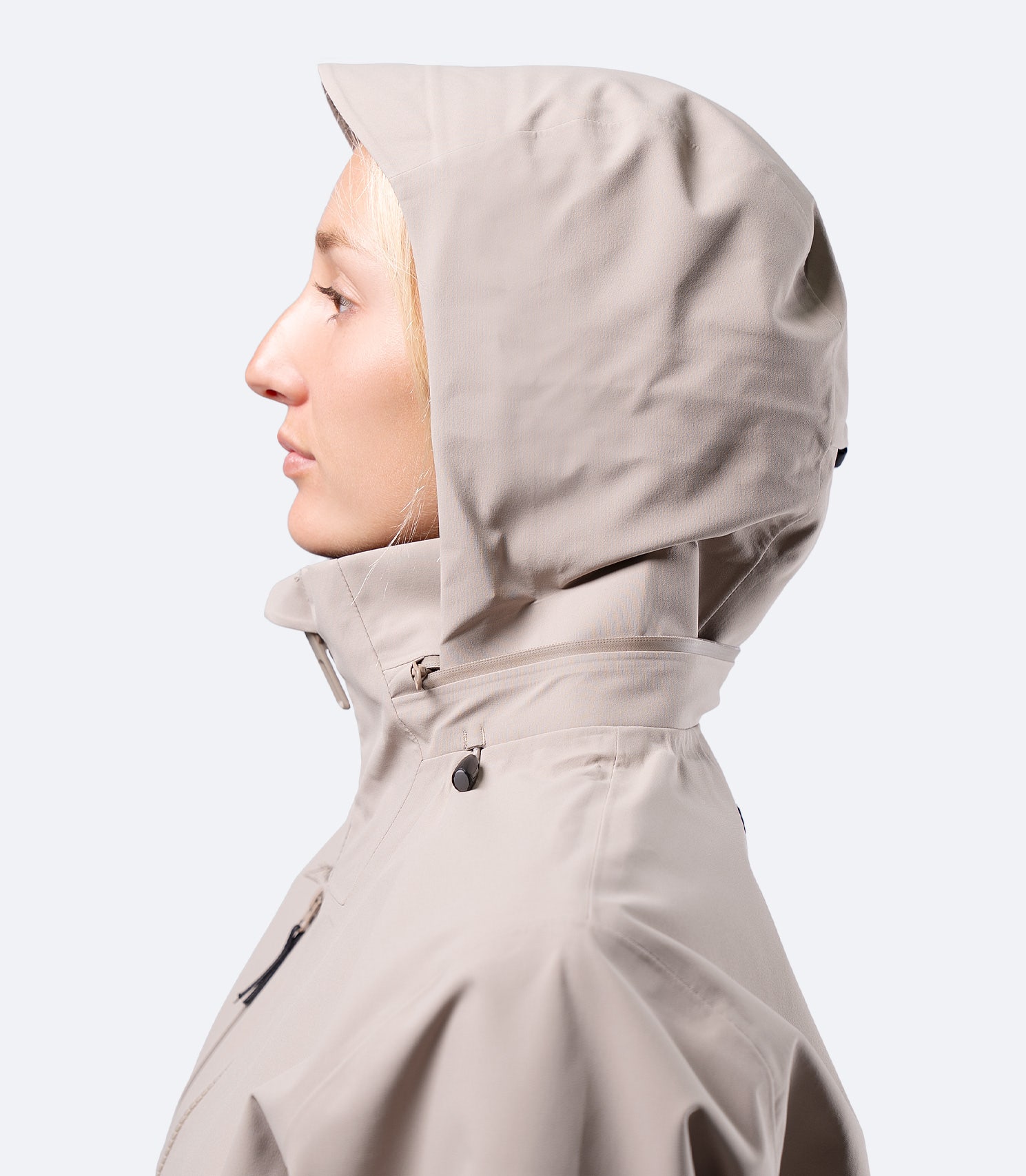 Side view of hood on Zhik Women's INS400 jacket in Stone, showing snug fit around face for weather protection