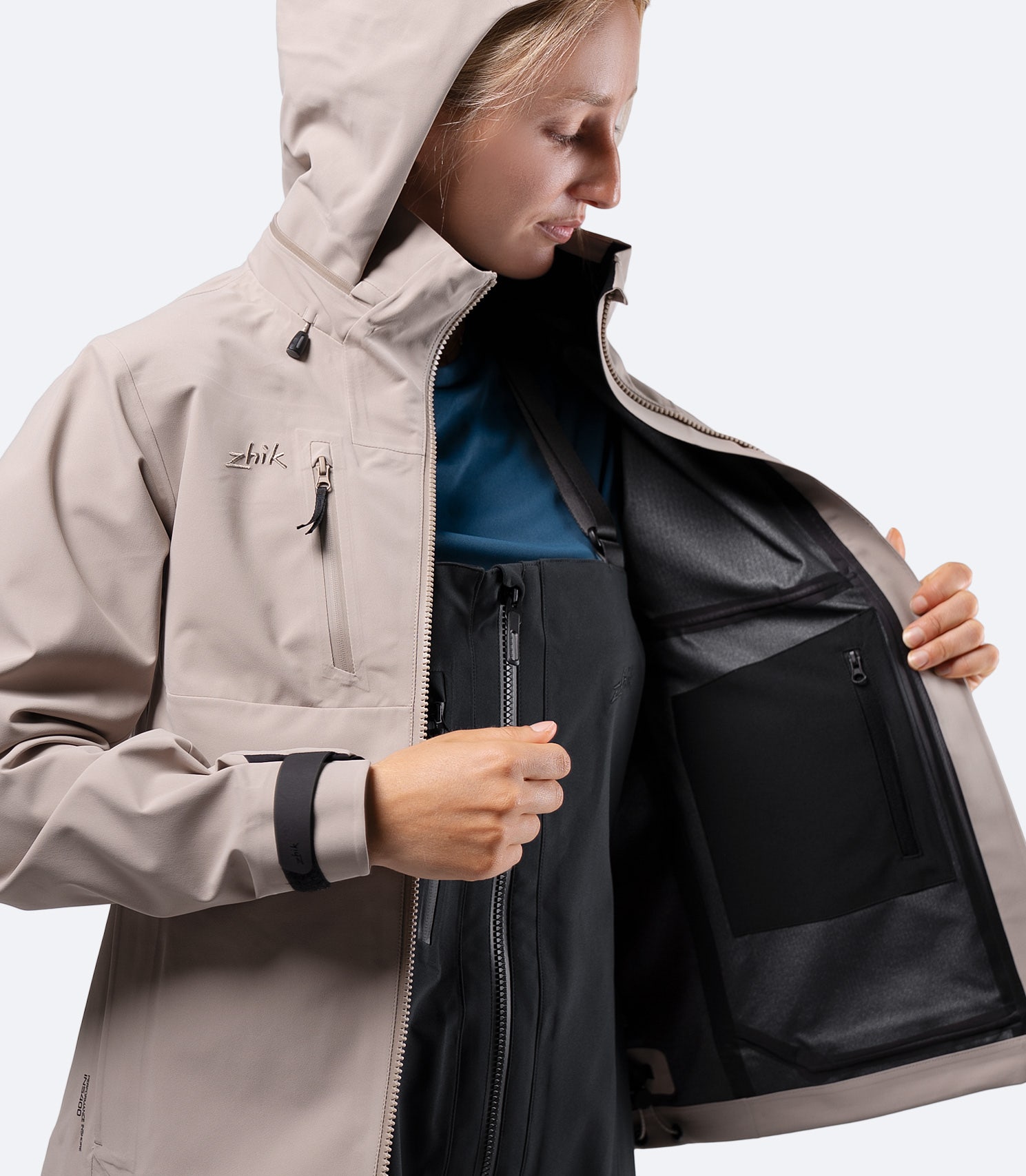 Interior of Zhik Women's INS400 jacket in Stone, showing Internal zip pocket with stretch storage bag