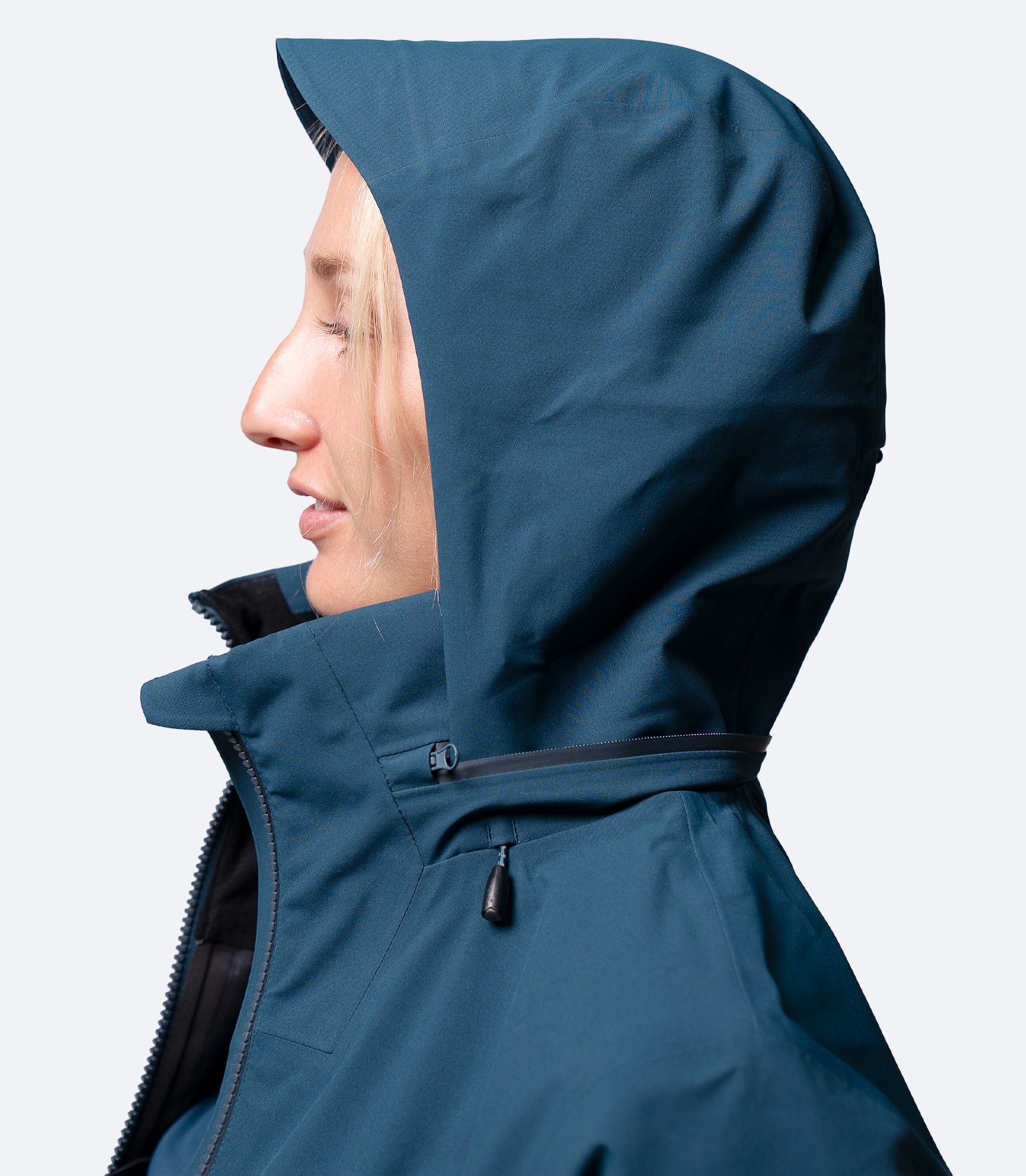 Side view of hood on Zhik Women's INS400 jacket in Deep Teal, showing snug fit around face for weather protection