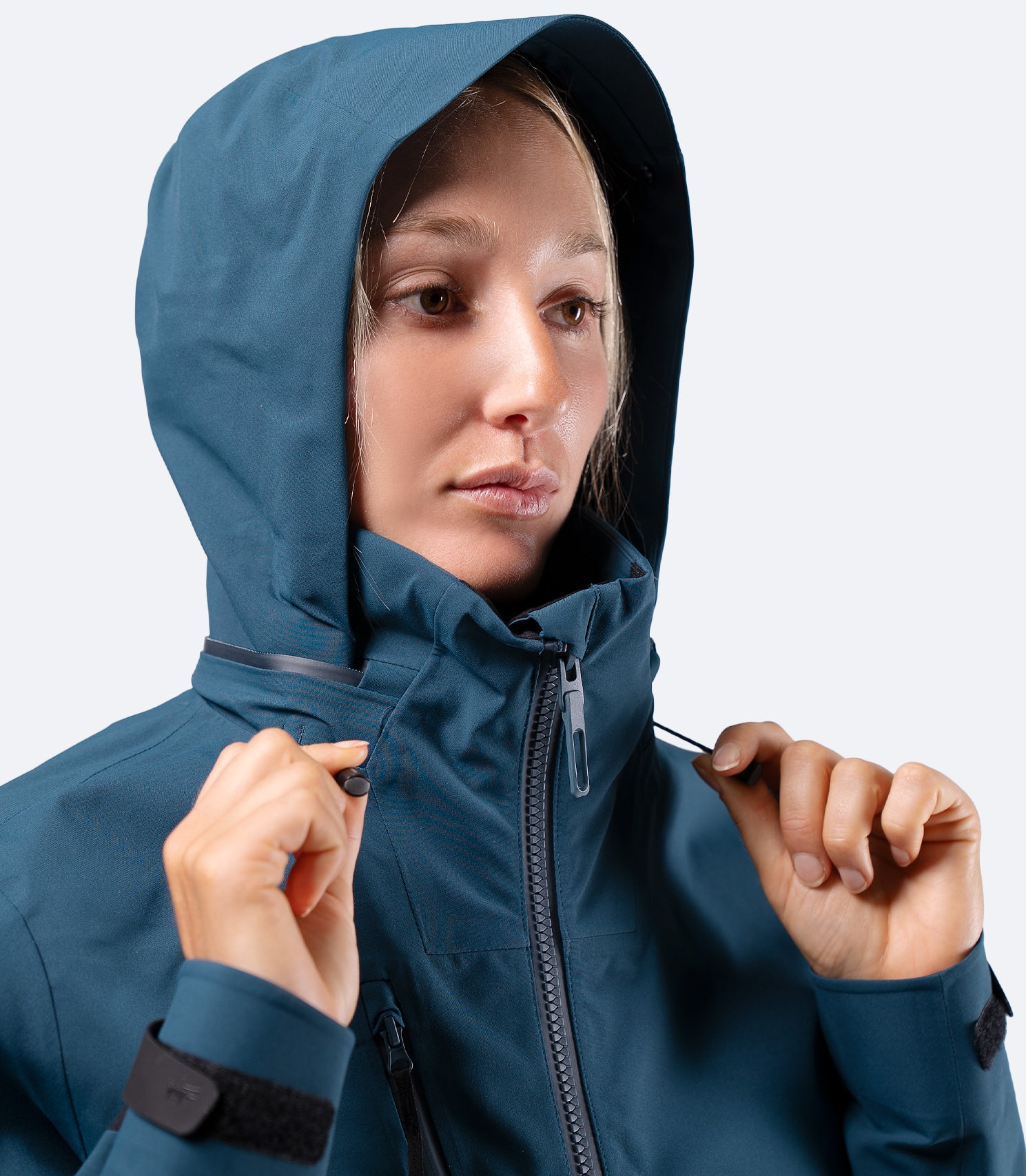 Front view of hood on Zhik Women's INS400 jacket in Deep Teal, showing snug fit around face for weather protection