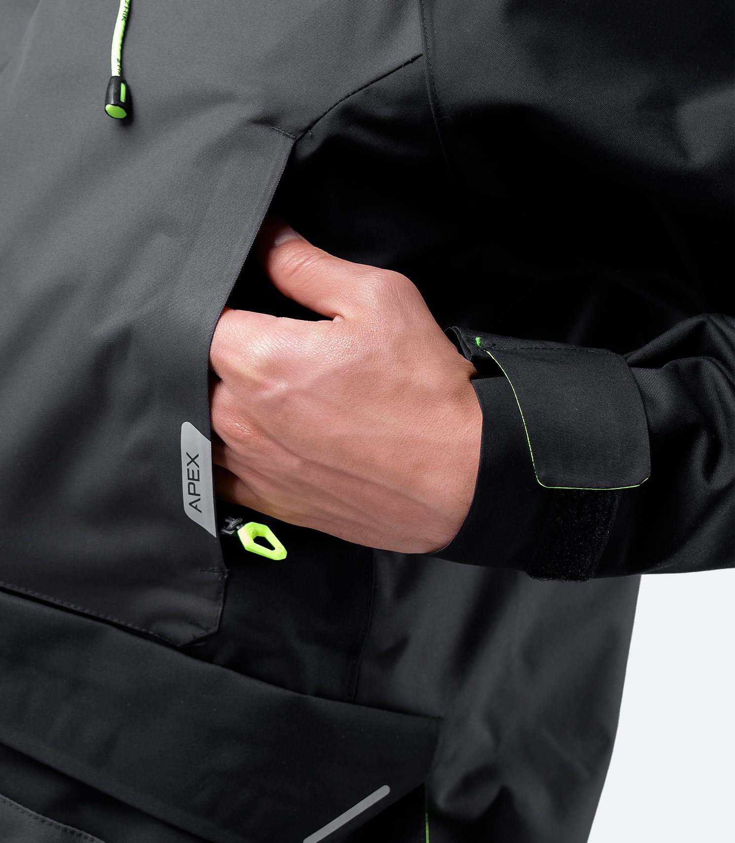 Zhik Men's OFS700 Jacket in Flame Red, highlighting chest outer pockets with durable water-resistant zippers for secure storage.