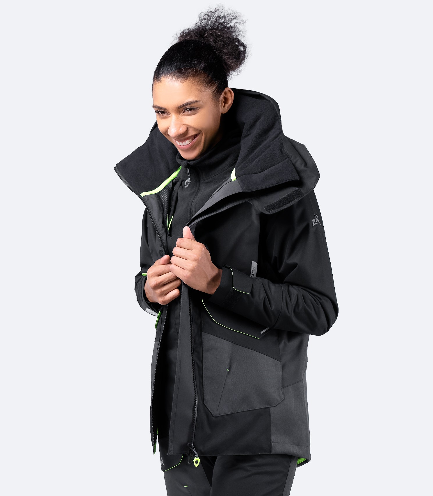 Open view of Zhik Women's Black OFS700 Jacket with soft fleece mesh lining, fully taped seams, and internal PU wrist cuffs for water resistance.
