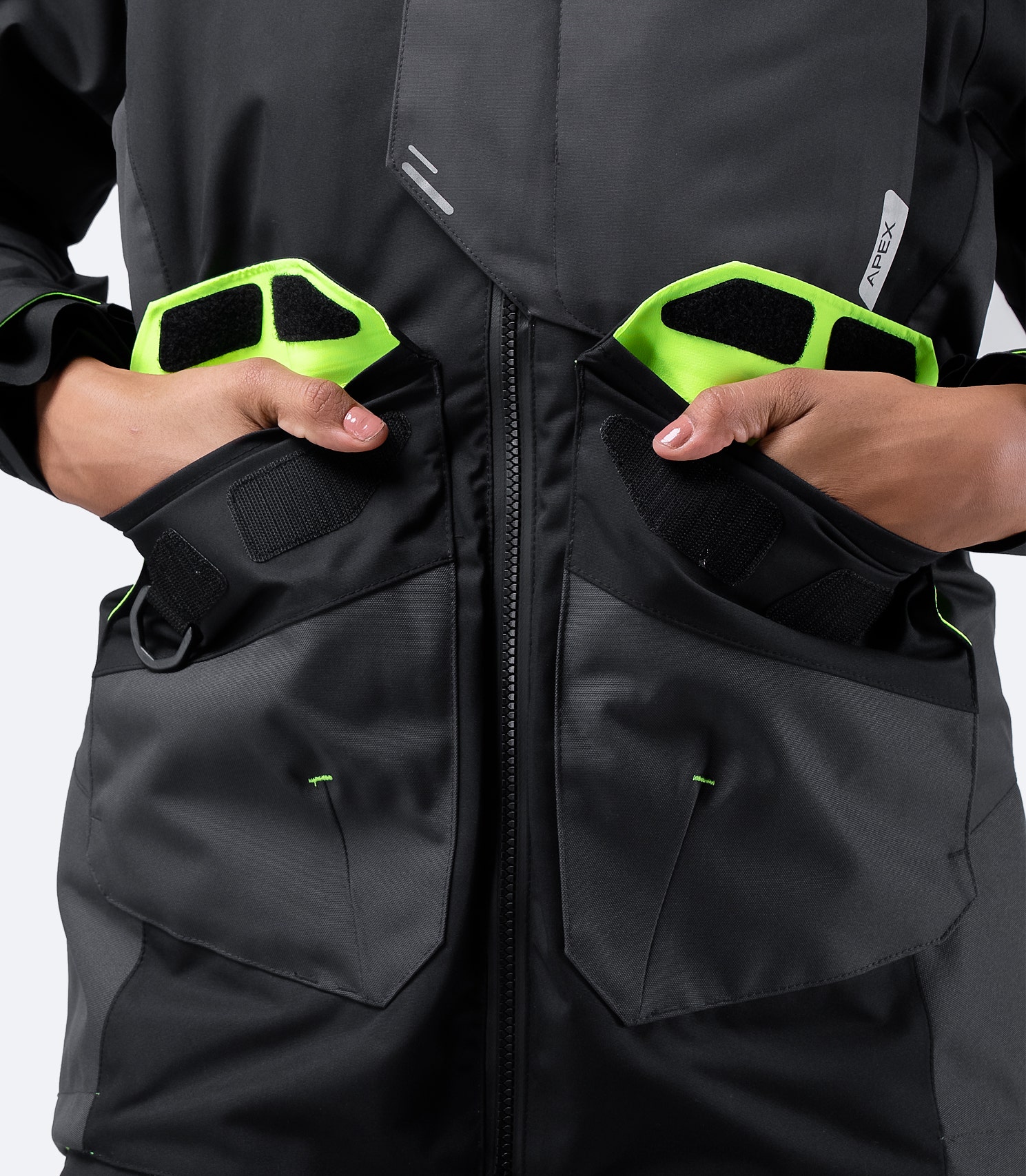 Zhik Women's Black OFS700 Jacket front cargo pockets with hidden fleece hand warmer pockets, designed for warmth and convenience offshore.