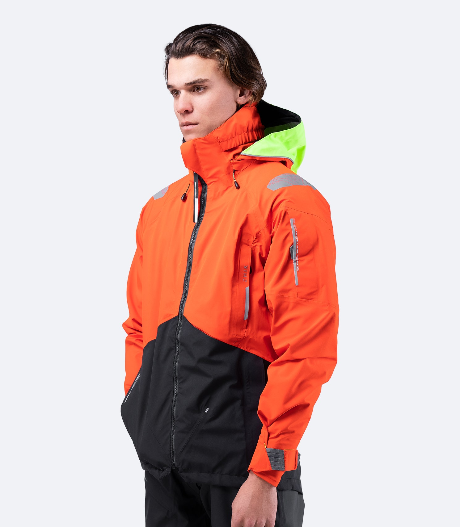 Front view of Zhik Men's CST500™ Jacket in Flame Red, featuring a central YKK® Aquaguard zipper and medium-height coastal collar.
