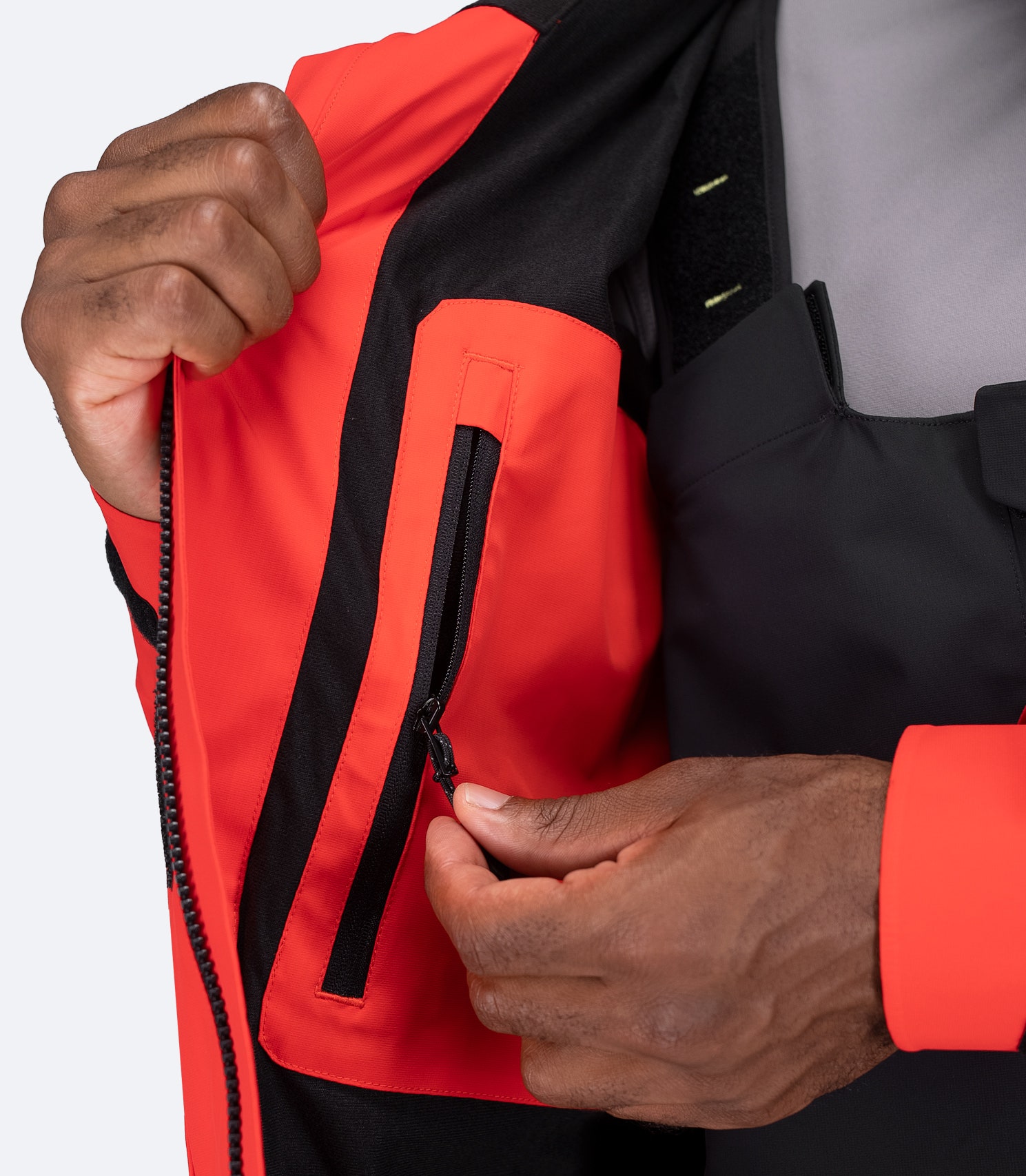 Interior close-up of flame red OFS600 Jacket, showing valuables chest pocket and breathable mesh lining.