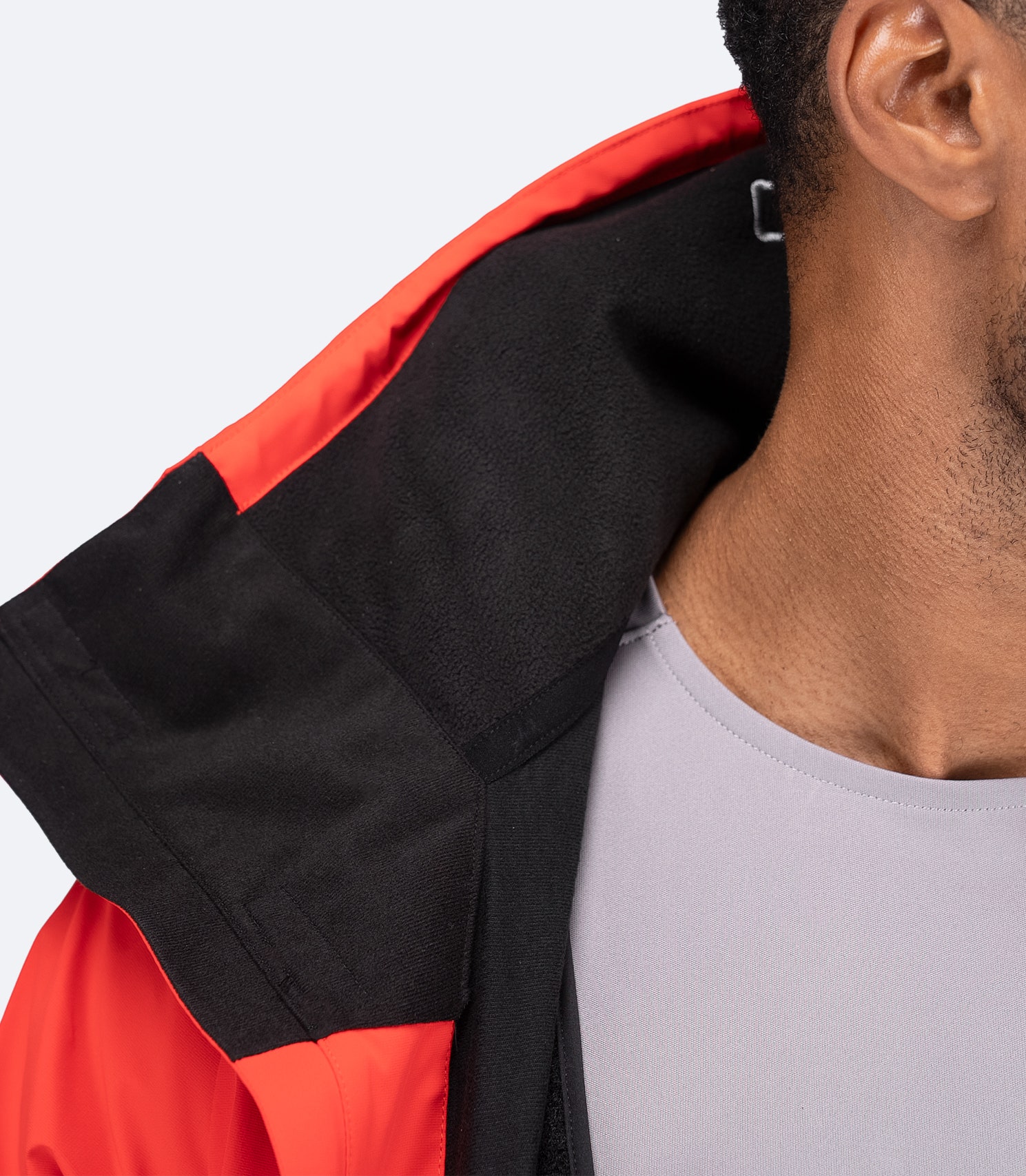 Close-up of inner collar on flame red OFS600 Jacket, highlighting soft quick-dry fleece lining and medium-height storm collar.