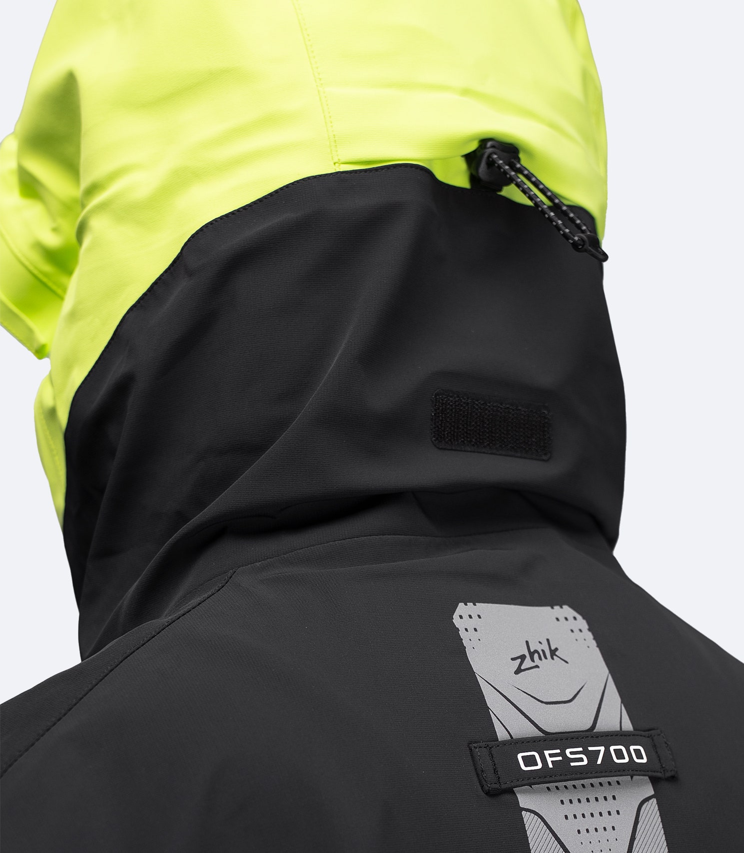 Black OFS700 jacket close-up of rear collar and shoulders with Oralite® reflectors and taped seams.