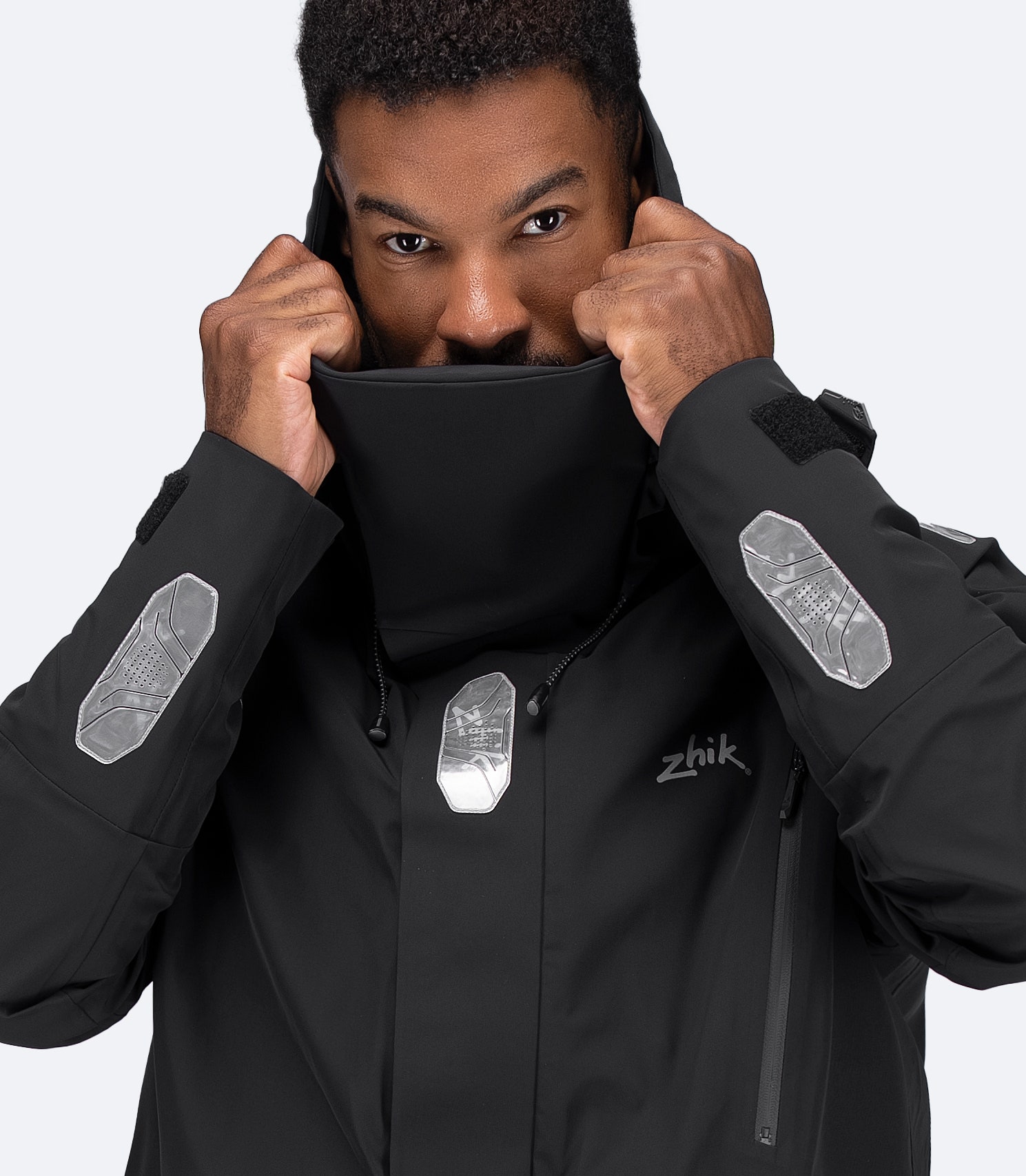 Close-up of black OFS700 jacket collar, fleece-lined storm collar and shoulder seam-taping visible.