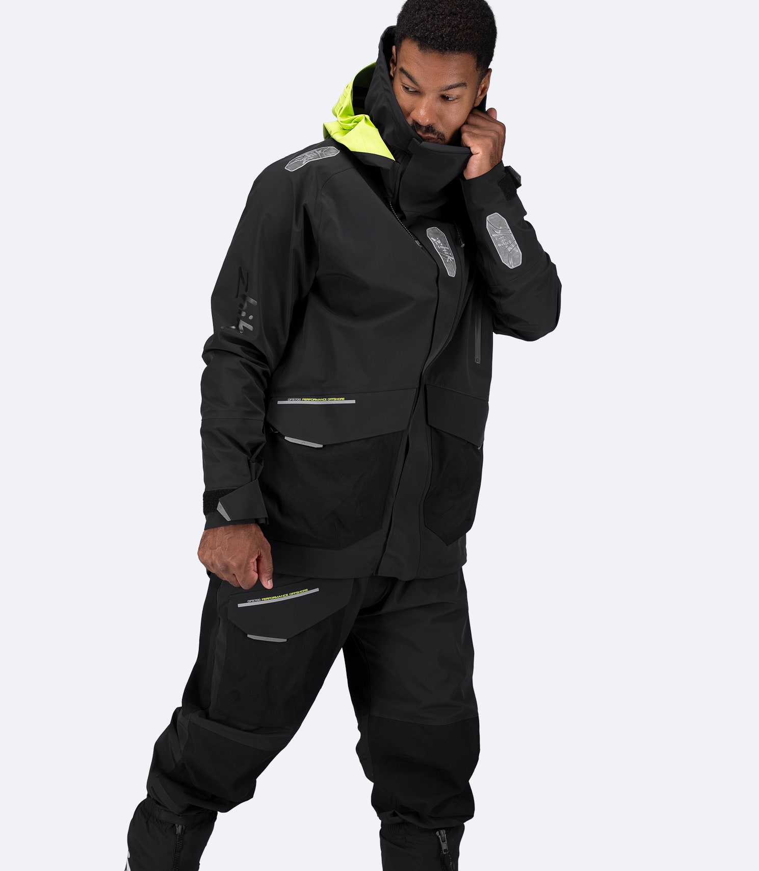 Side view of black Zhik OFS700 Offshore Jacket highlighting streamlined cut and waterproof construction.
