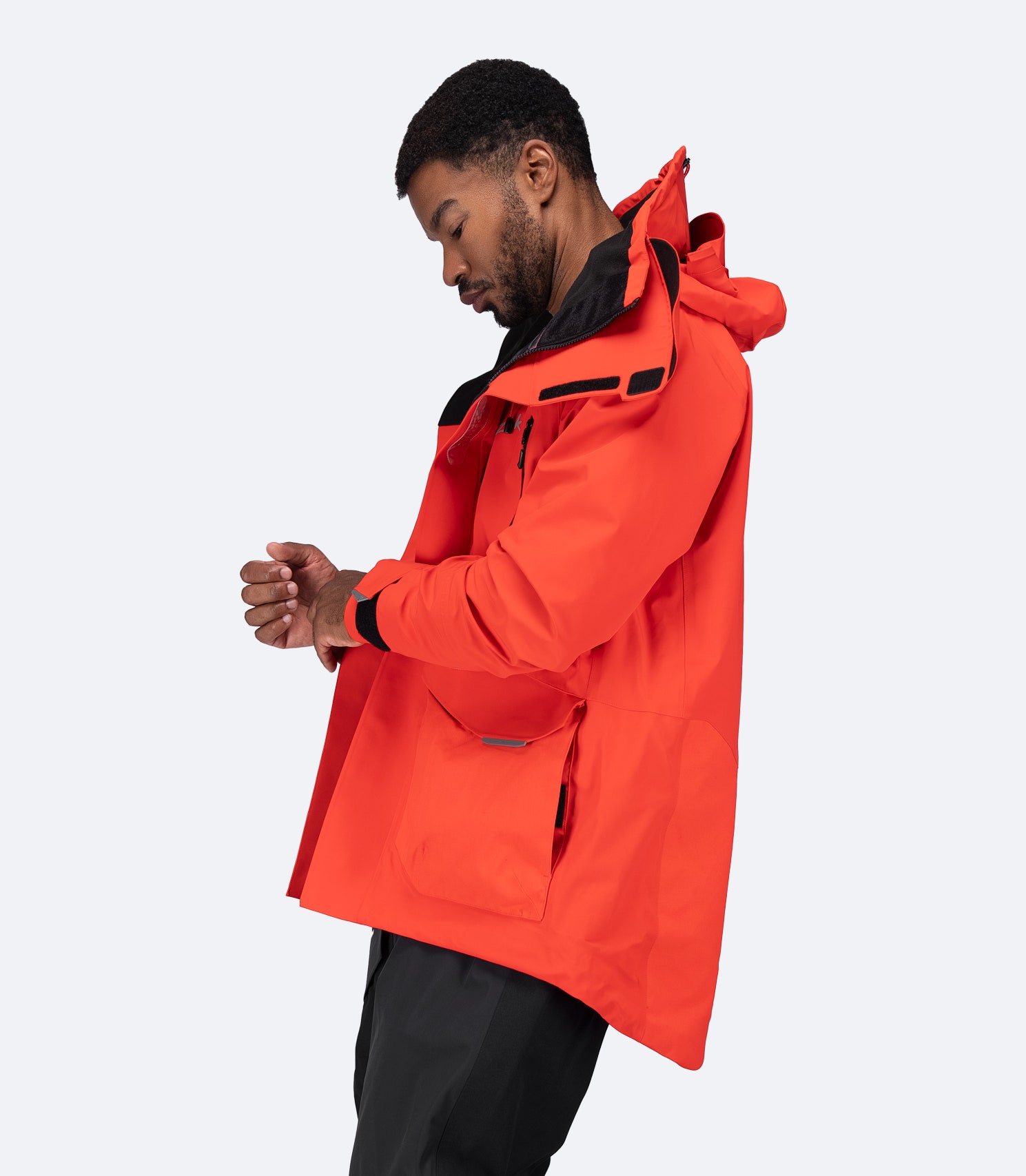 Side view of flame red OFS700 Jacket showing articulated fit and waterproof breathable design.