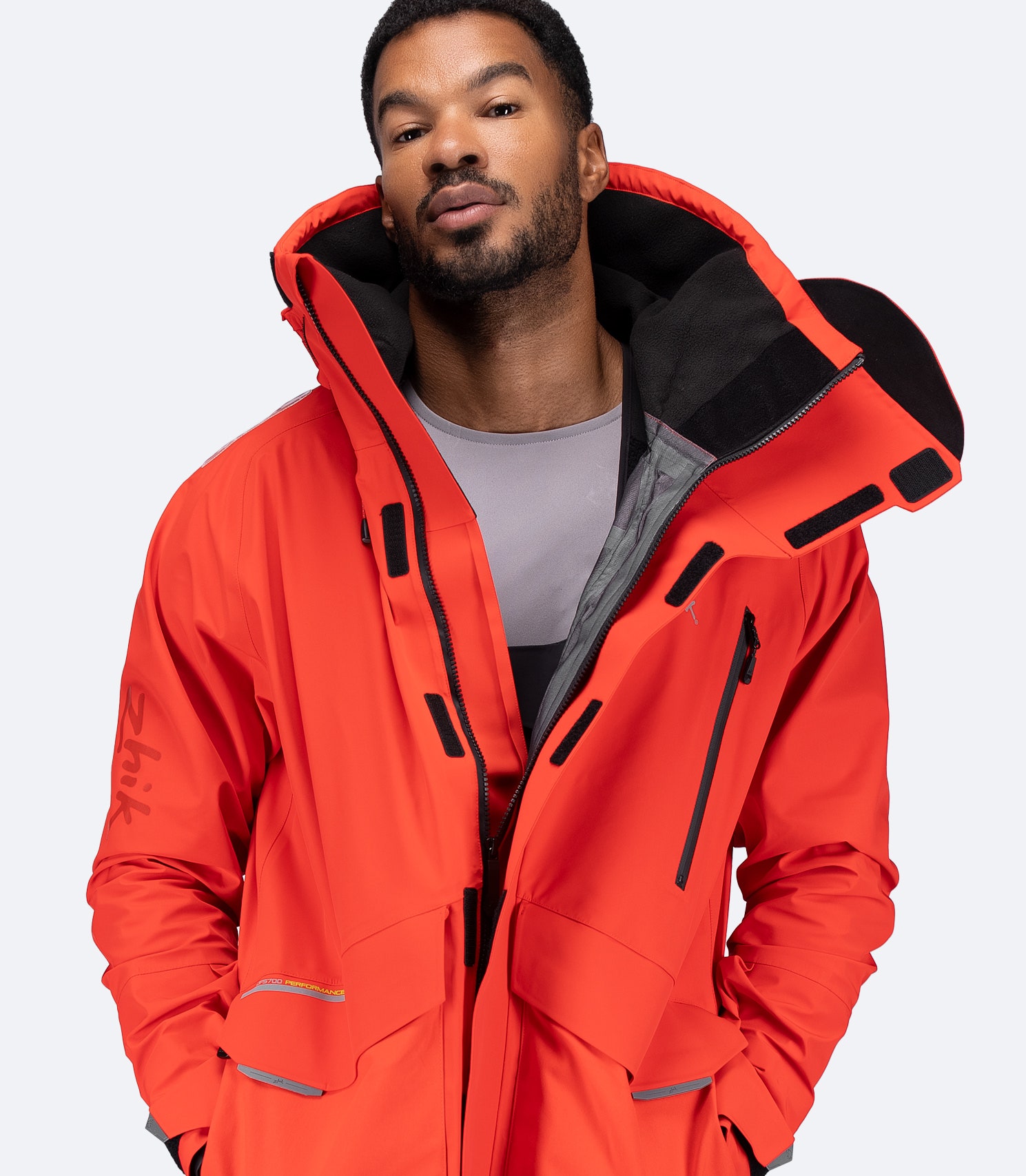 Front view of flame red OFS700 Jacket unzipped, showing interior fleece lining and seam-taped finish.