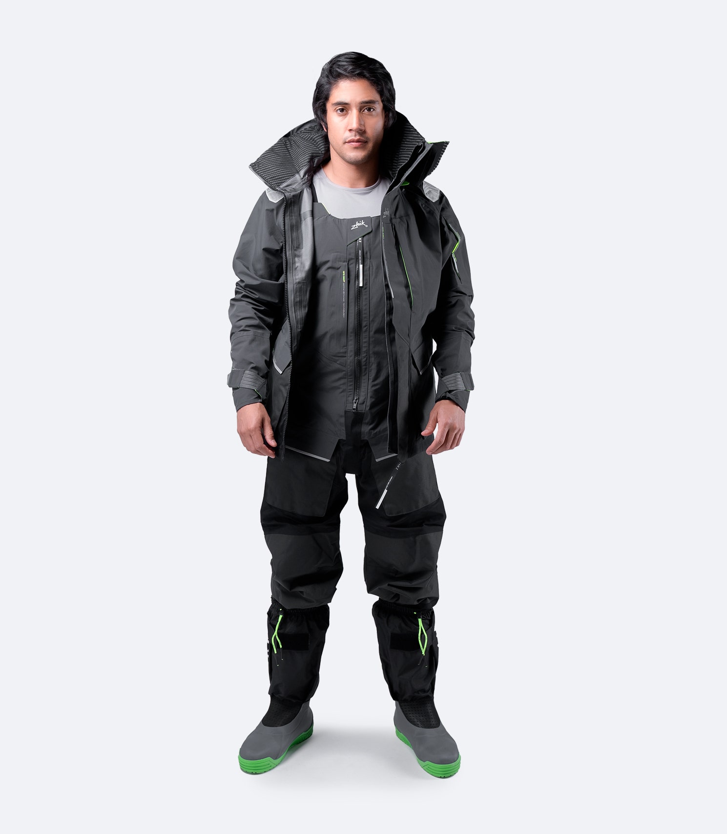 Zhik OFS800™ Jacket in black worn casually with zip undone, showcasing a relaxed fit and breathable high-performance fabric.