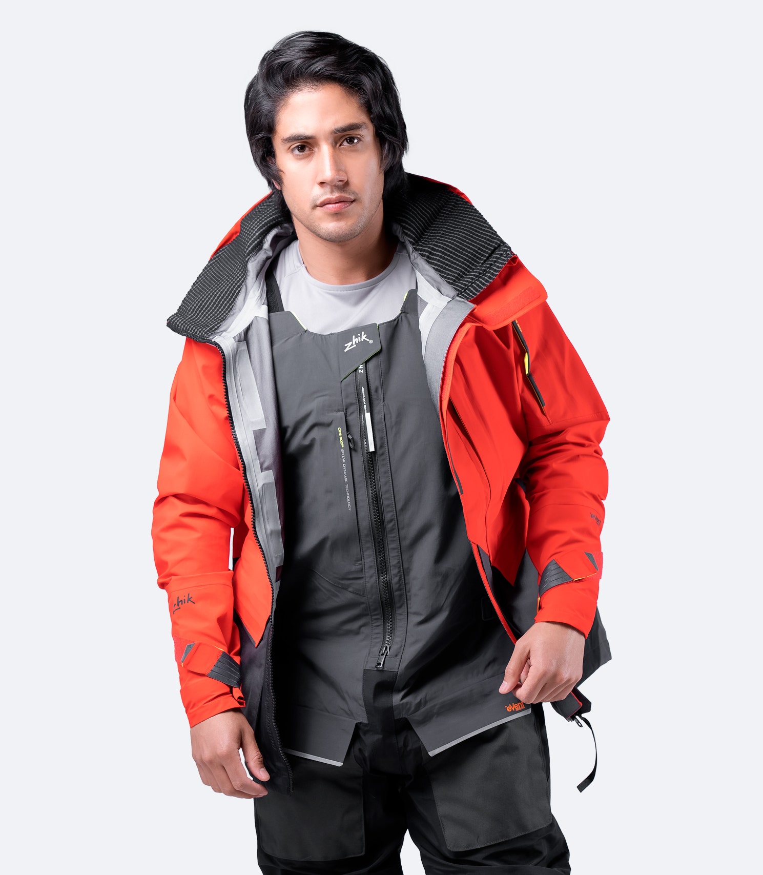 Zhik OFS800™ Jacket in Flame Red with front zipper open, showcasing Hydrobase® lining and functional interior design