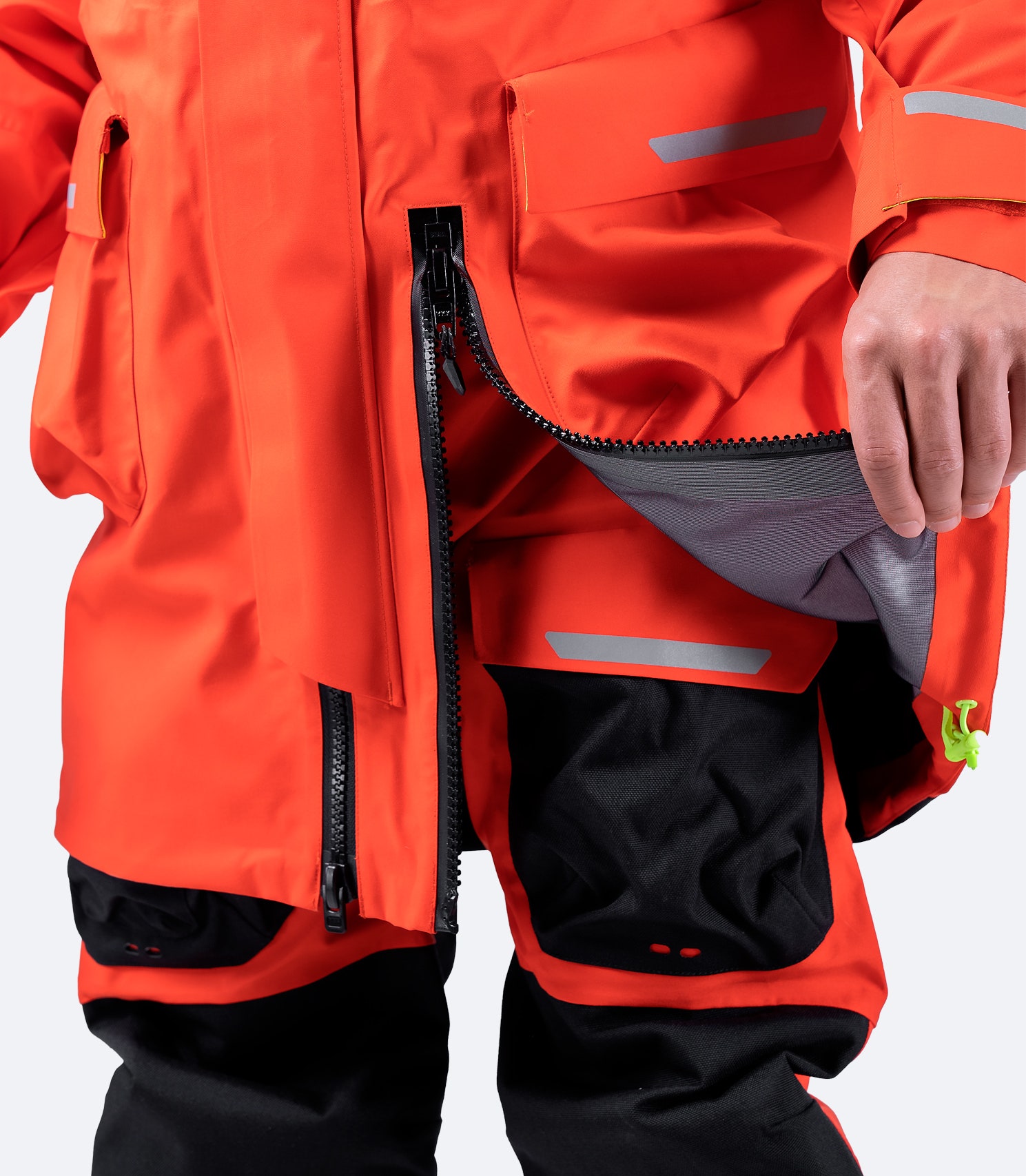 Close-up of inner neoprene waist skirt on flame red Zhik Isotak X Jacket, designed to prevent water flushing and enhance protection