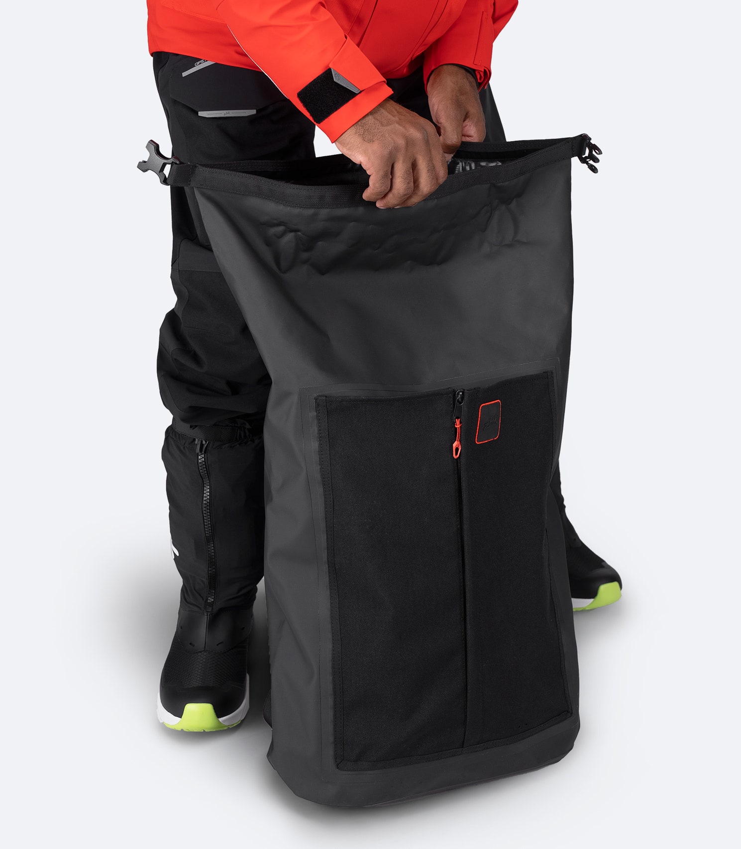 Zhik 35L Waterproof Backpack in black with open roll-top showing spacious interior and elasticated laptop sleeve.