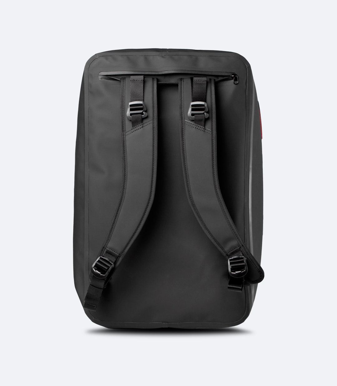 Back view of Zhik 45L Submersible Waterproof Duffel in black, featuring stowable backpack straps and reinforced durability.