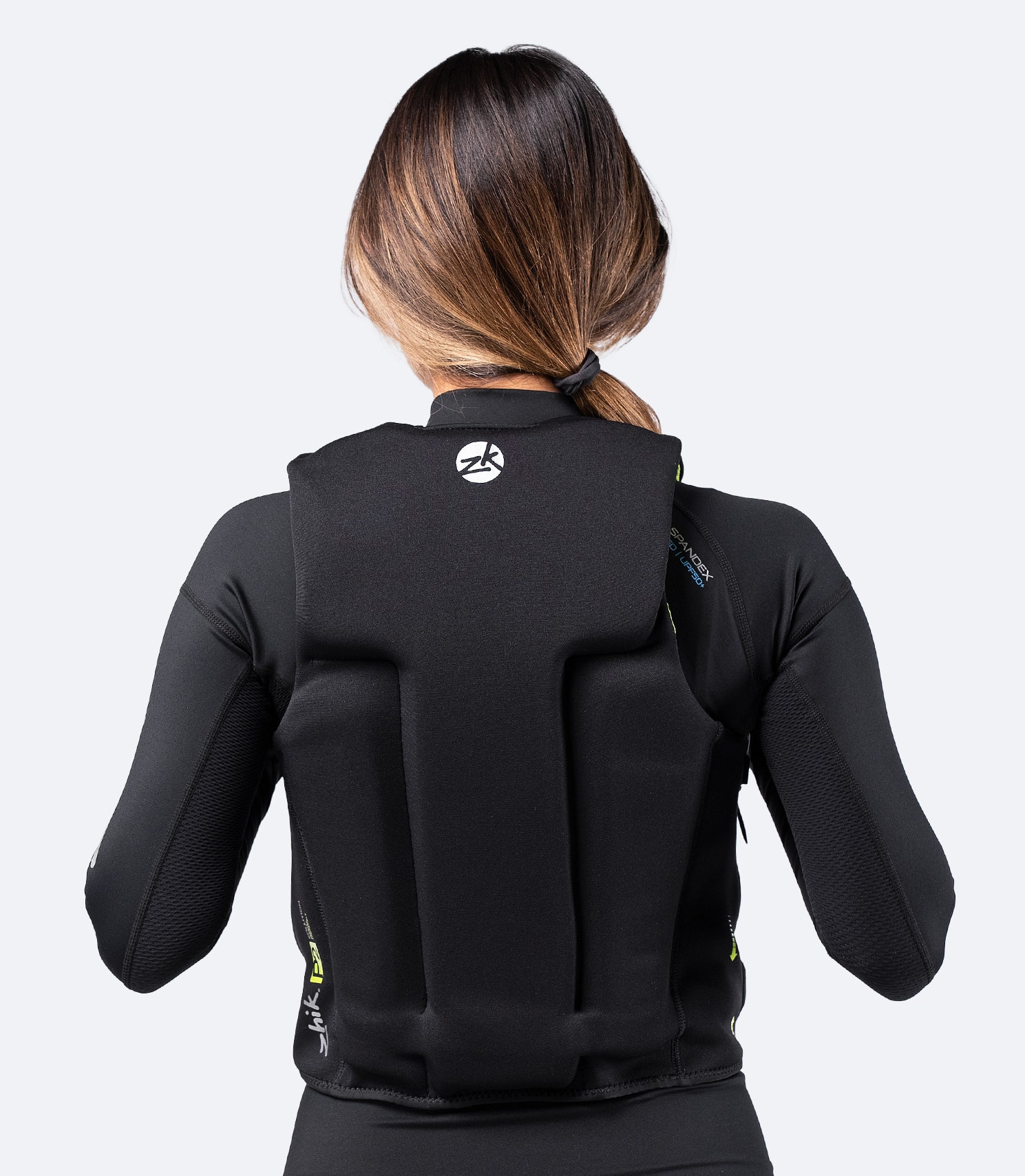 Rear view of Zhik P2 PFD in black, highlighting ergonomic profile, breathable internal mesh, and stretch panels for unrestricted movement.