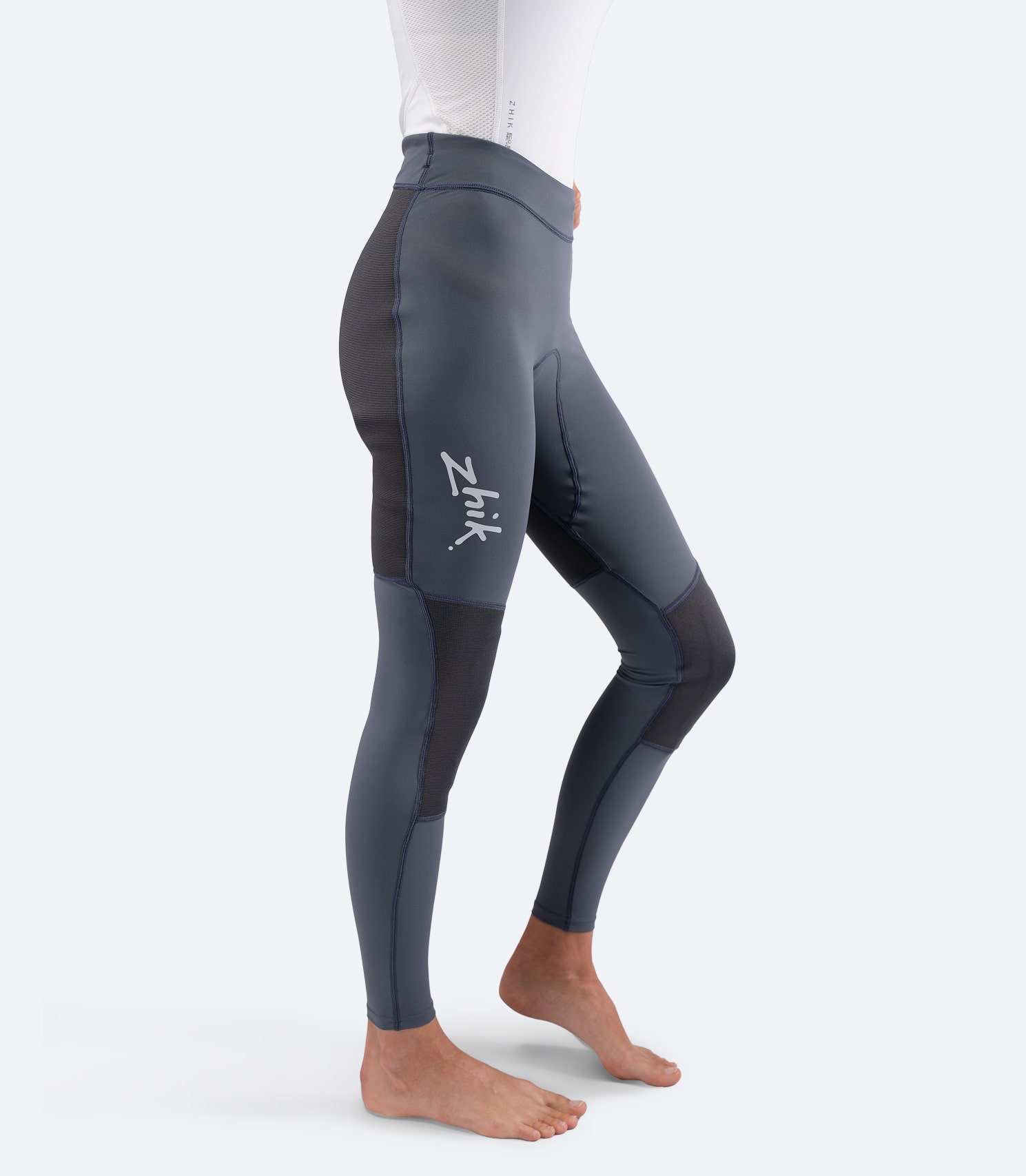 Zhik Women's Hybrid Gear Performance Pants in Grey, side view showing high-waisted profile and ZhikTex II knee protection.