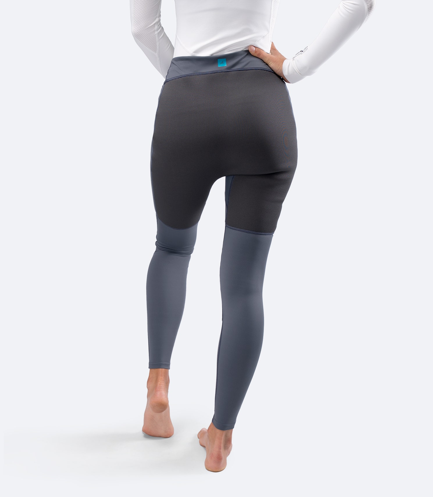 Zhik Women's Hybrid Gear Performance Pants in Grey, rear view showing reinforced seat panel for abrasion resistance.