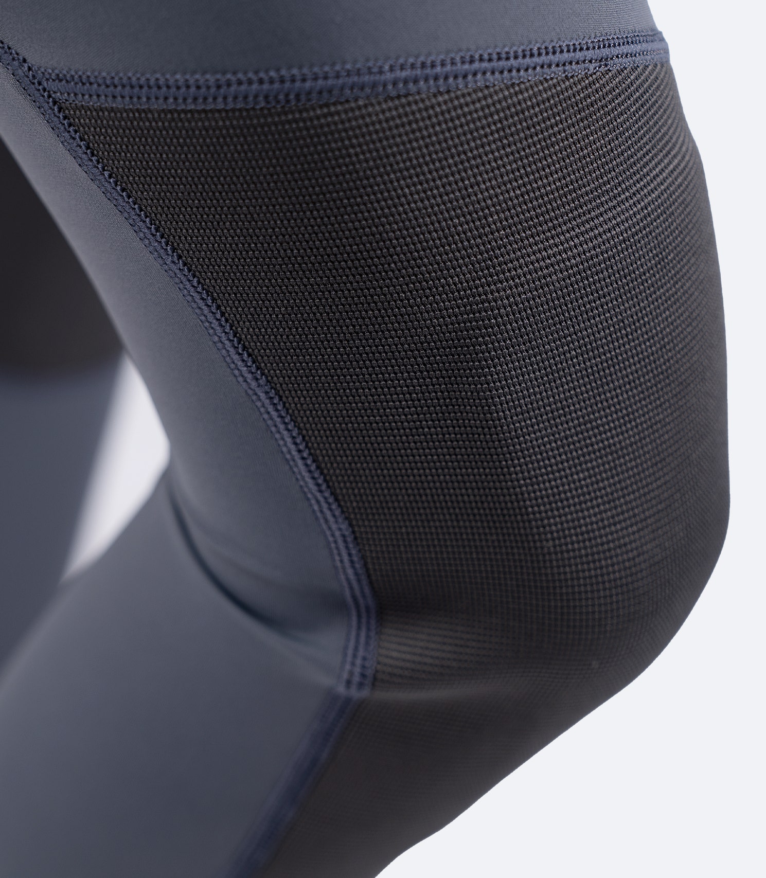 Close-up of Zhik Women's Hybrid Gear Performance Pants in Grey, showing reinforced knee padding with ZhikTex II durability.