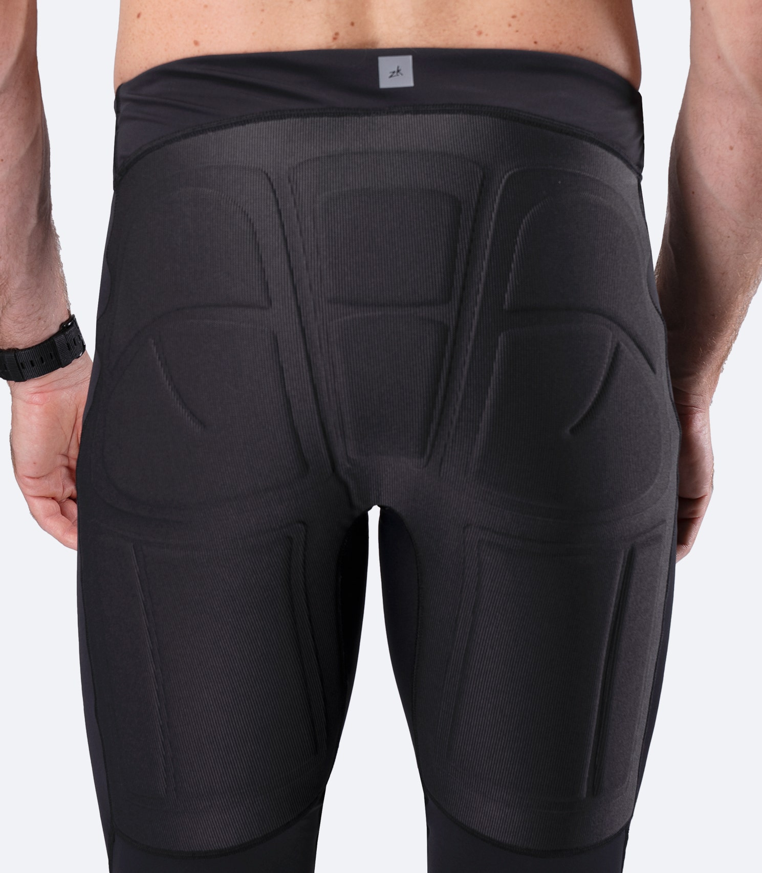 Rear view from knee to waist of Zhik DeckBeater X Pant in black, showing seat reinforcement and secure waistband fit