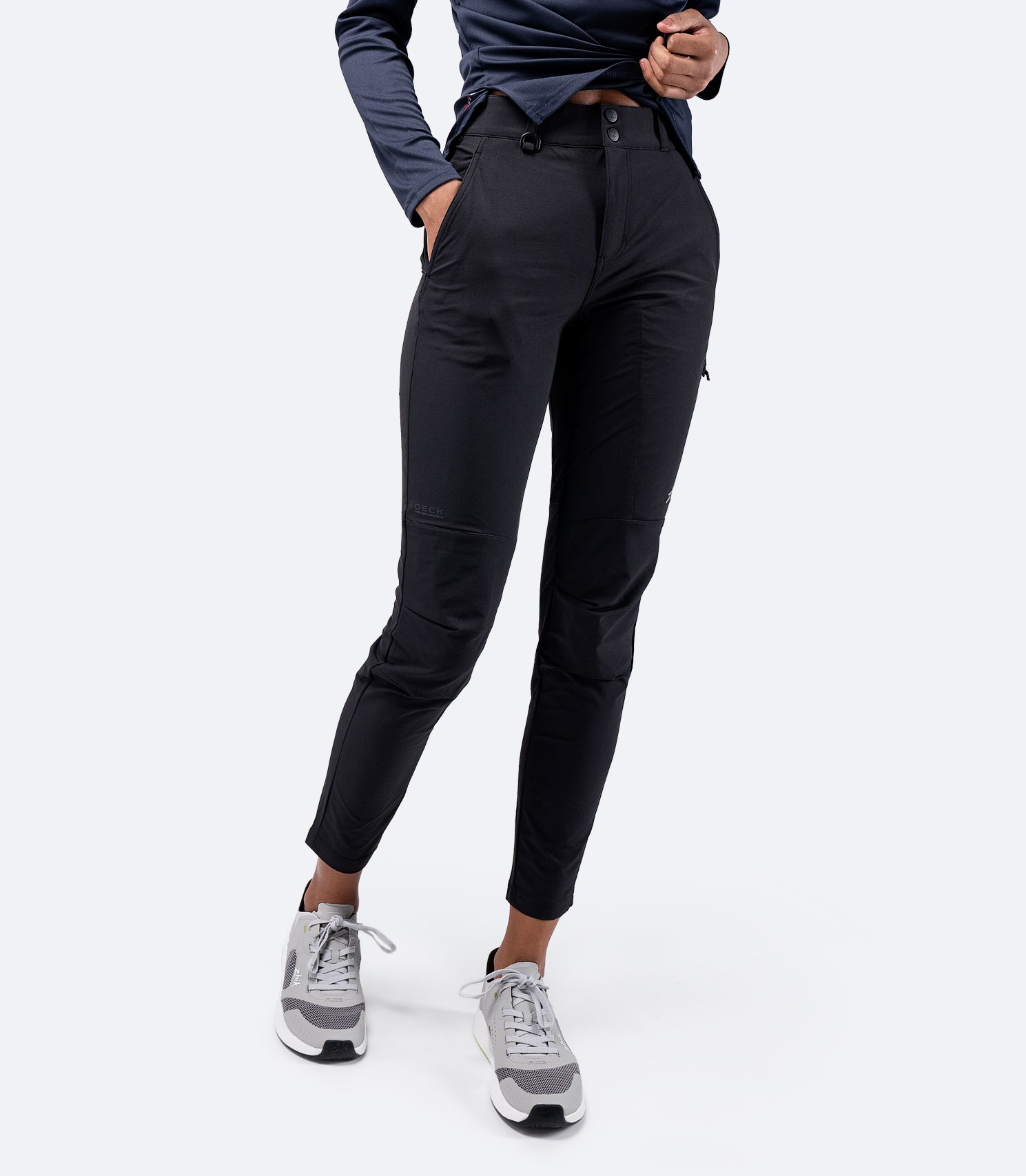 Front view of Zhik Women's Deck Pant in Black, showcasing a tailored fit with an elastic-lined waist for comfort and D-ring attachment point