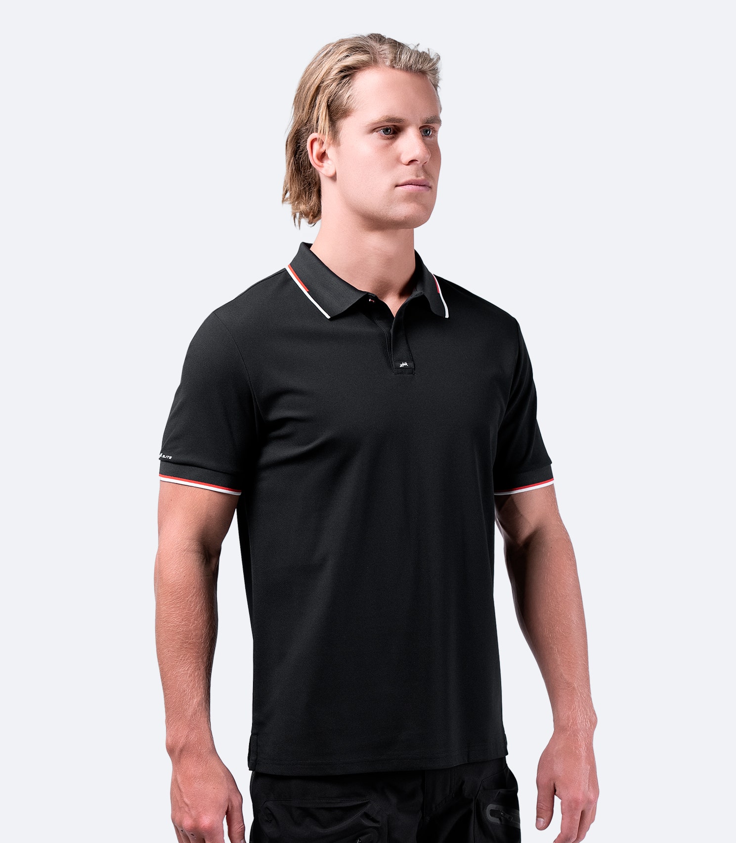 Front view of Zhik Men's Elite Polo in black, showcasing athletic fit, contrast stripe collar, and lightweight pique fabric.