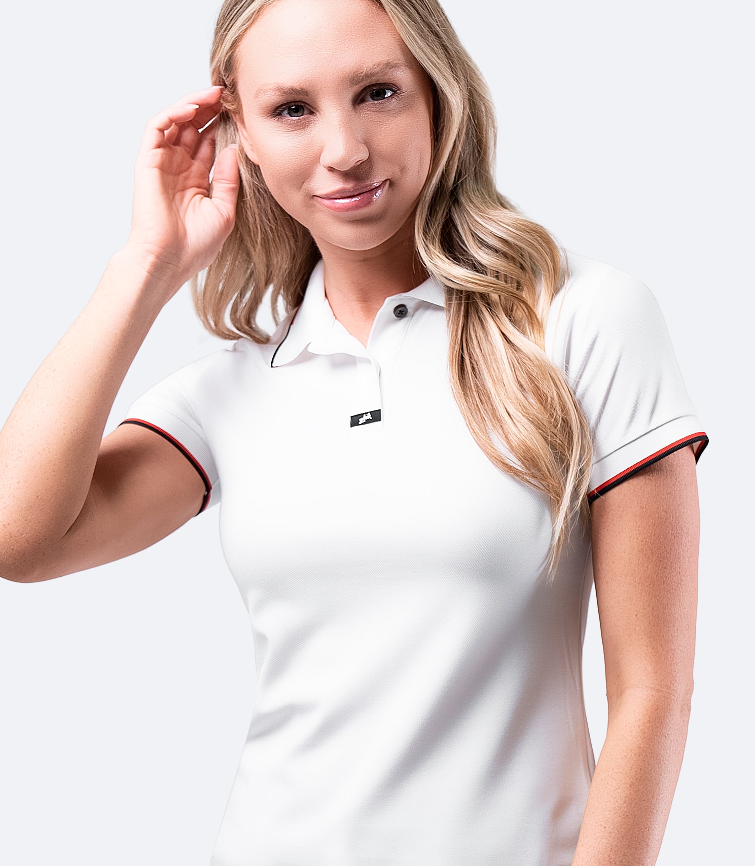 Zhik Women's Elite Polo in White, featuring a contrast collar and arm trim, made for active performance.