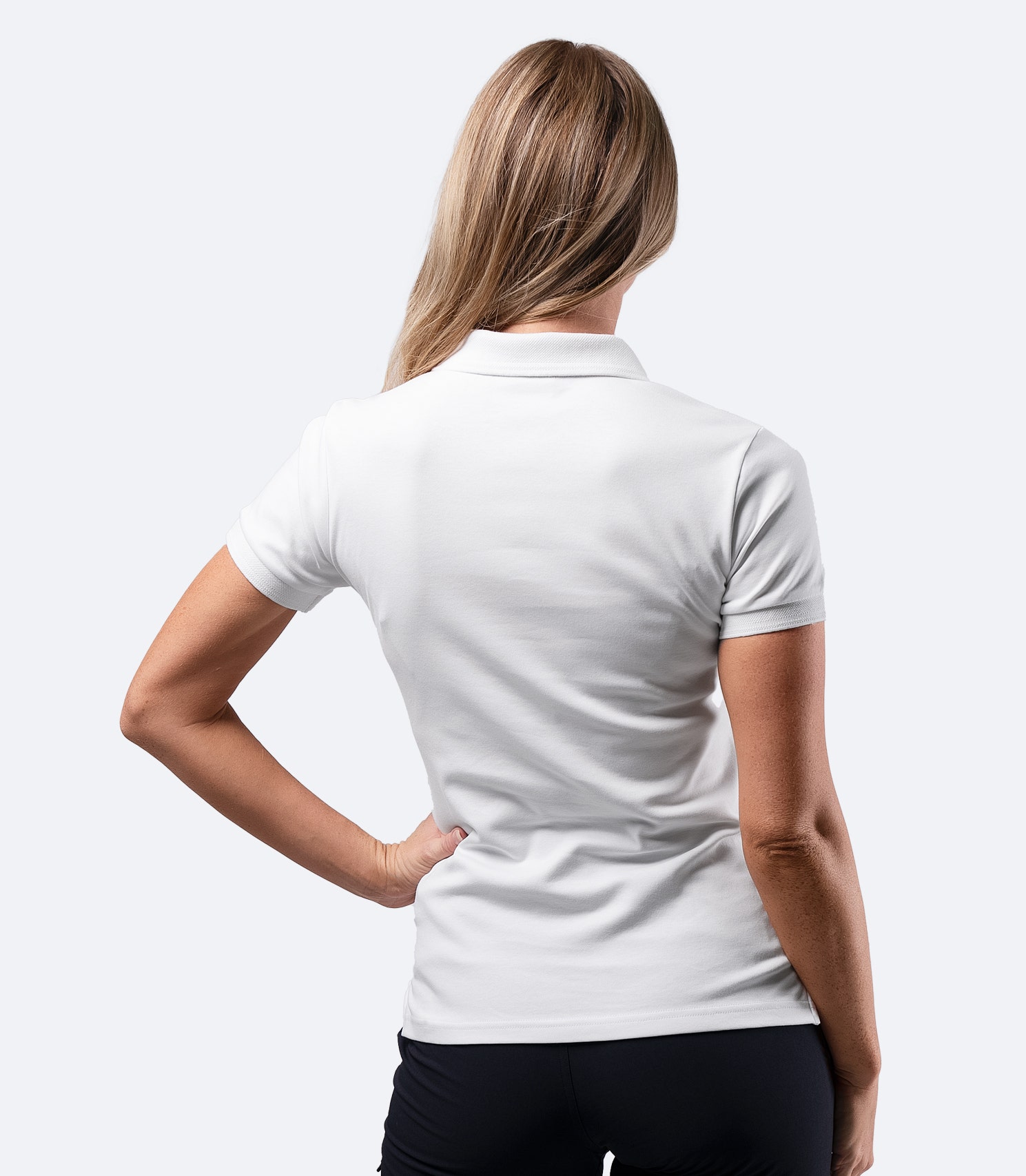 Rear view of Zhik Women's Pima Cotton Polo in white, made from soft Supima cotton with a classic and breathable design.