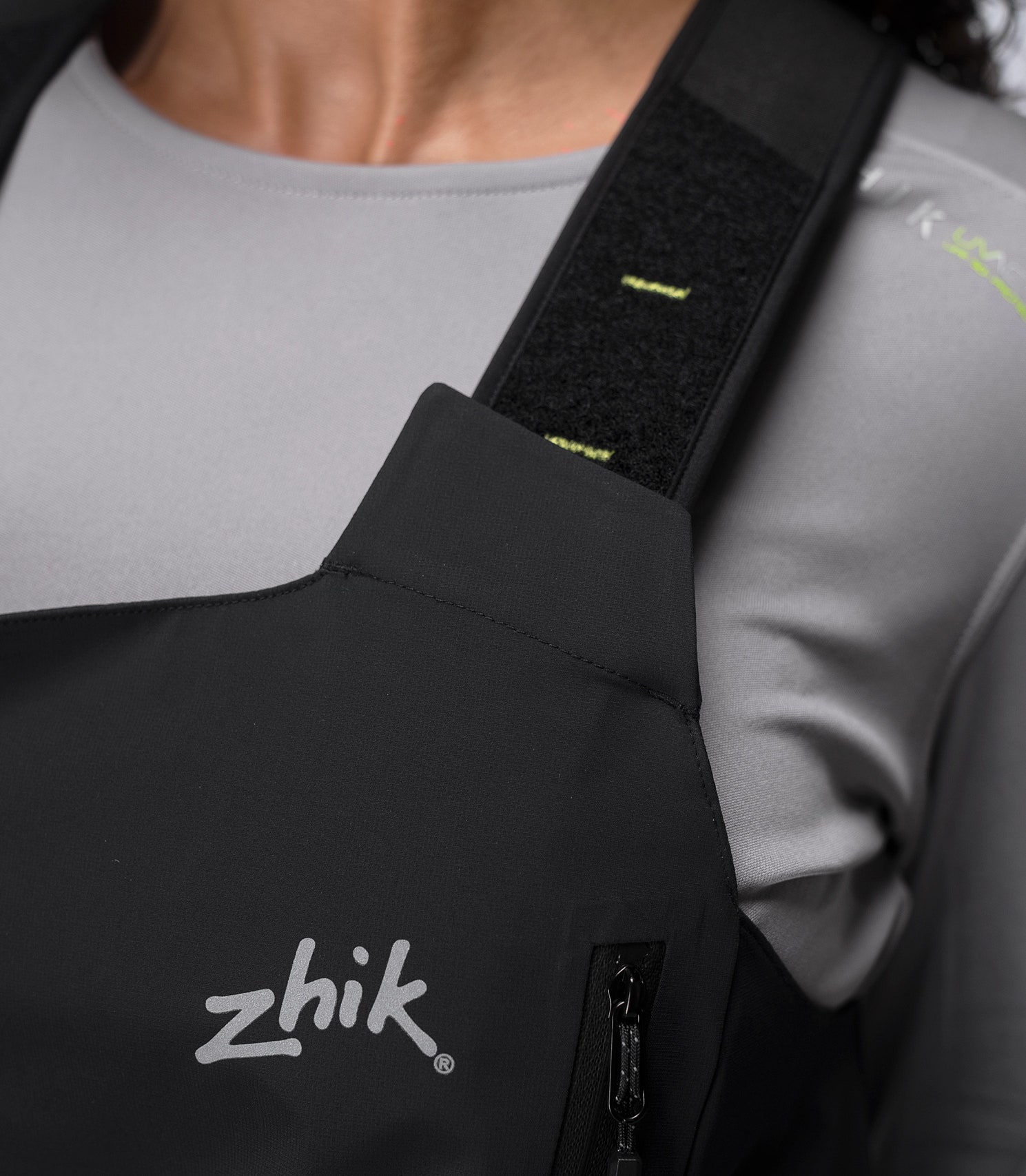 Shoulder strap close-up of Zhik Women's OFS700 Salopette in black with soft brushed elastic and shock absorption.