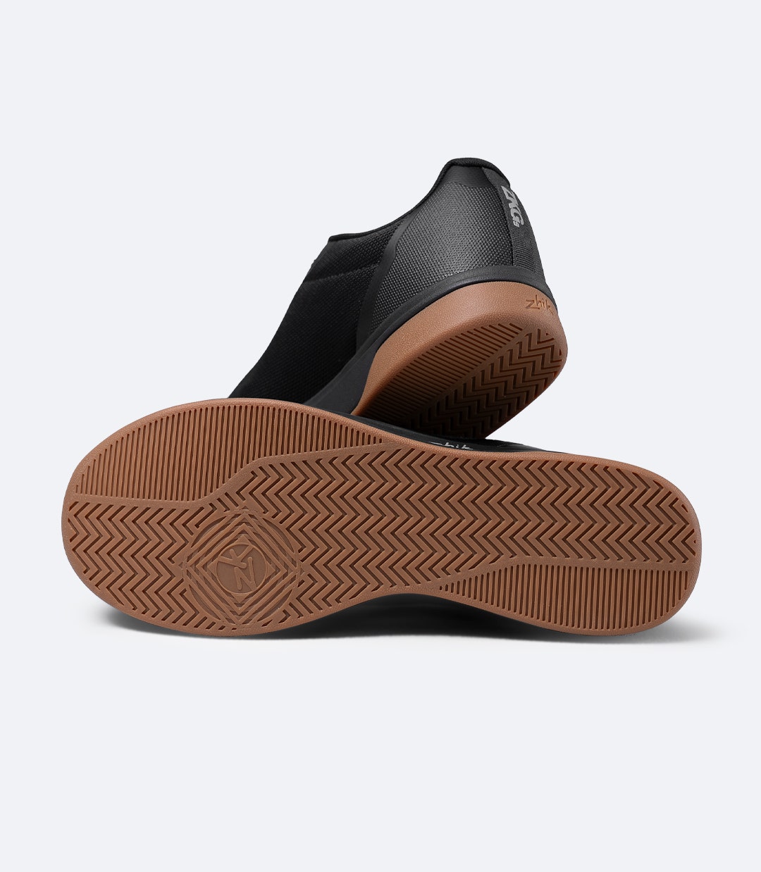 Pair of Zhik ZKG Amphibious Shoes in black stacked together, highlighting flexible, lightweight marine design