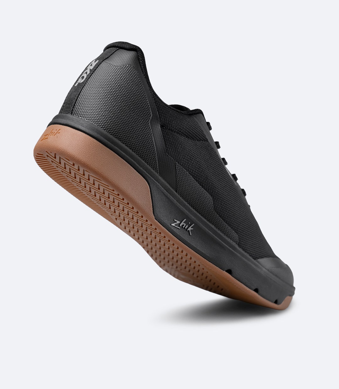 Rear angled view of Zhik ZKG Amphibious Shoe in black with raised heel, showing cushioned collar and TPU heel overlay