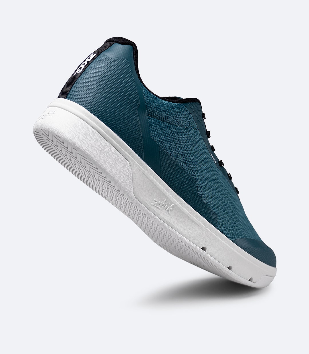 Rear side view of Zhik ZKG Amphibious Shoe in deep teal with lifted heel, showing cushioned opening and heel support
