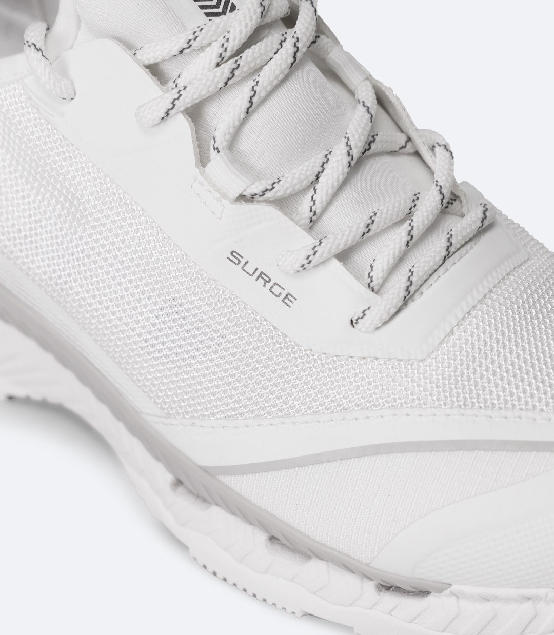 Close-up of Surge branding on white Zhik shoe near laces, with mesh upper and fused structure visible.