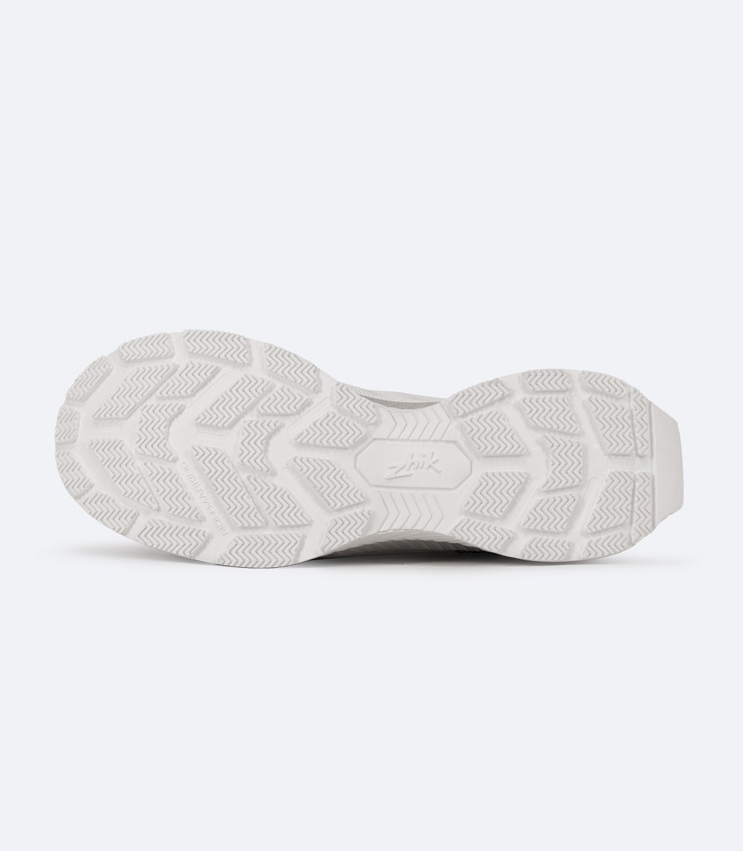 Sole view of white Zhik Surge Performance Race Shoe showing deep tread pattern and siping grooves for multi-surface grip.