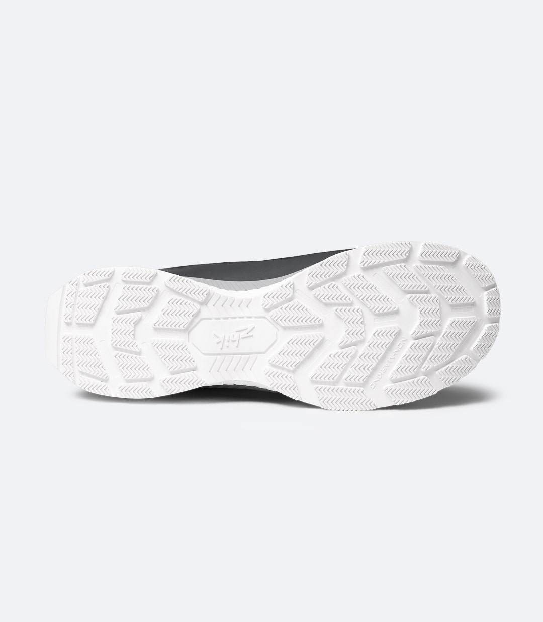 Sole view of Black Zhik Surge X waterproof shoe highlighting deep-tread hybrid rubber outsole for wet-deck grip