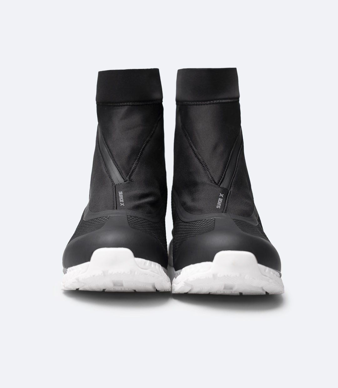 Front view of two Black Zhik Surge X waterproof race shoes showing pull-tight lacing and streamlined waterproof gaiter