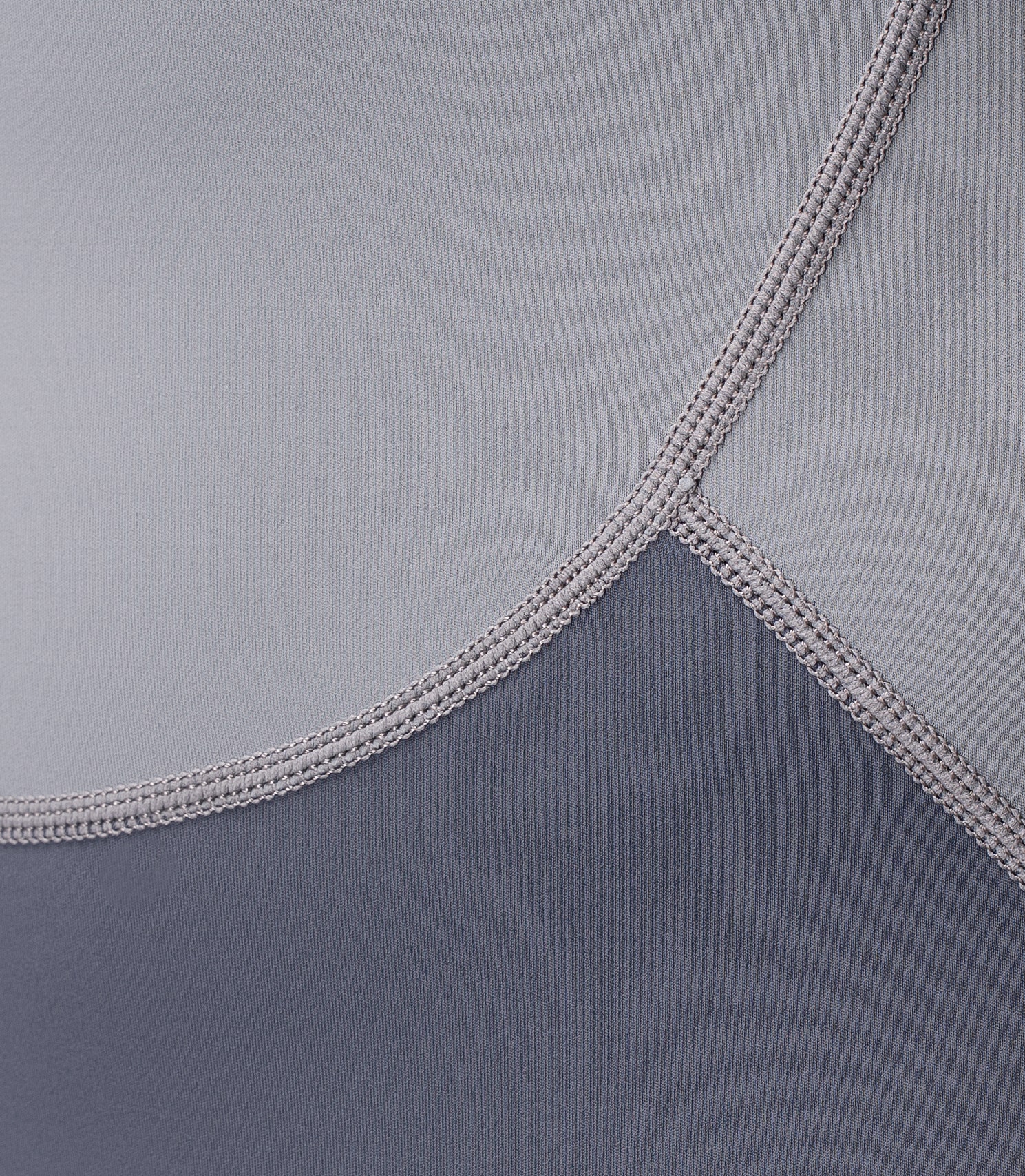 Close-up of Zhik Men's Hybrid Gear™ Performance Skiff Suit in Grey showing high-stretch flatlock stitching for comfort