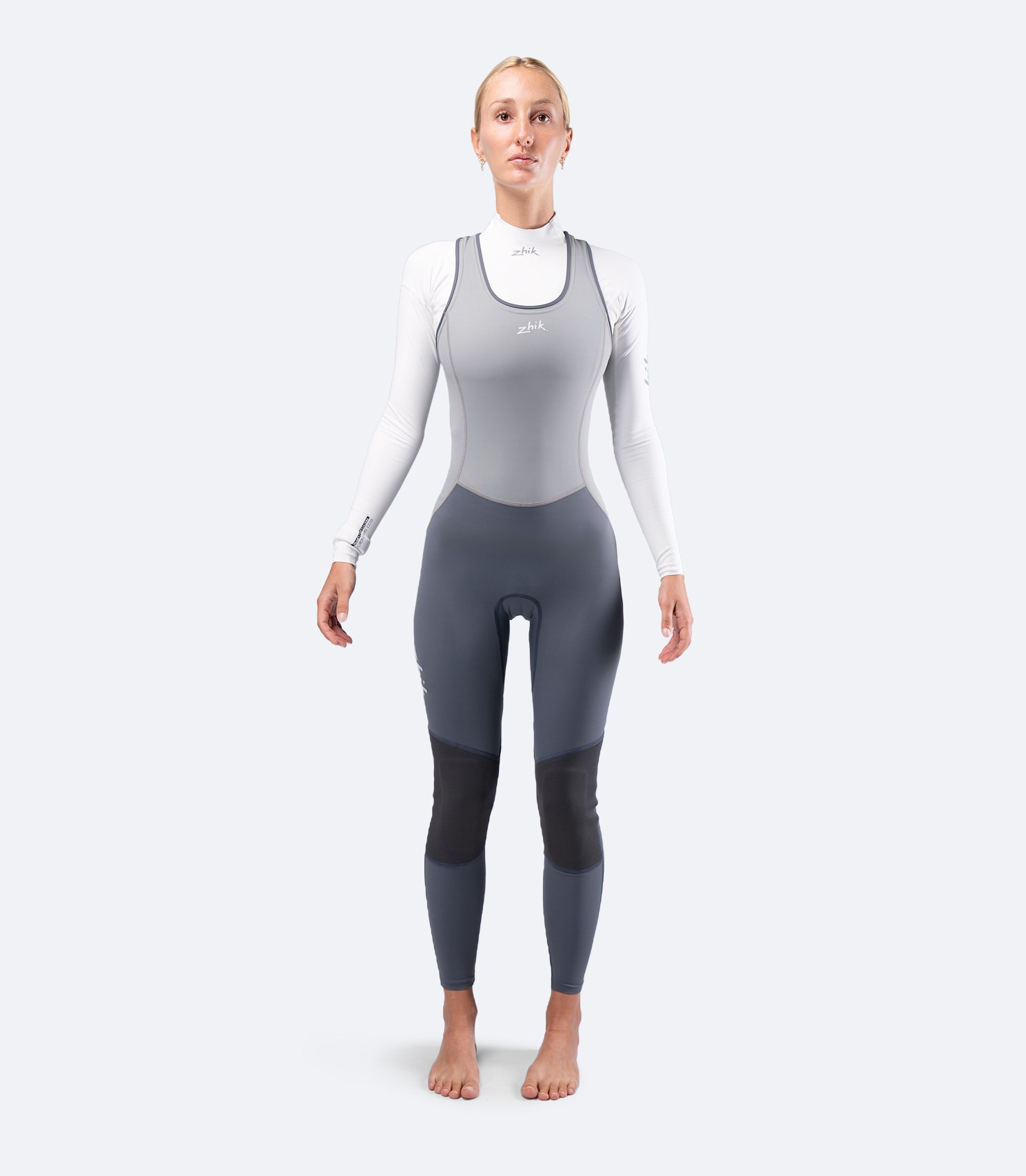 Front view of Zhik Women's Hybrid Gear Performance Skiff Suit in grey with UPF 50+ coverage and streamlined performance fit