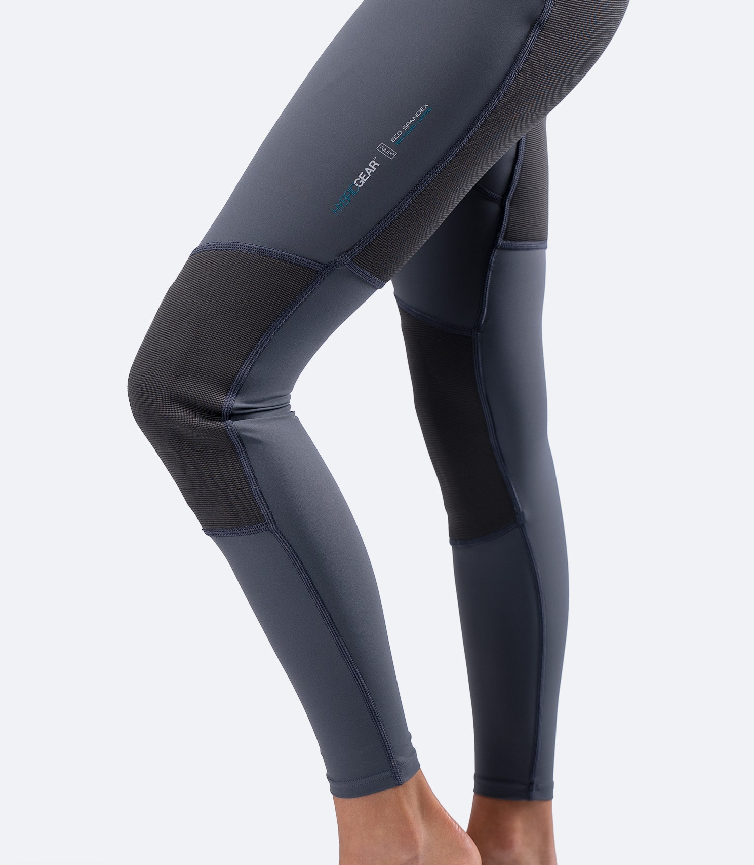 Side view legs of Zhik Women's Hybrid Gear Performance Skiff Suit in grey, showing abrasion-resistant knee panels for durability